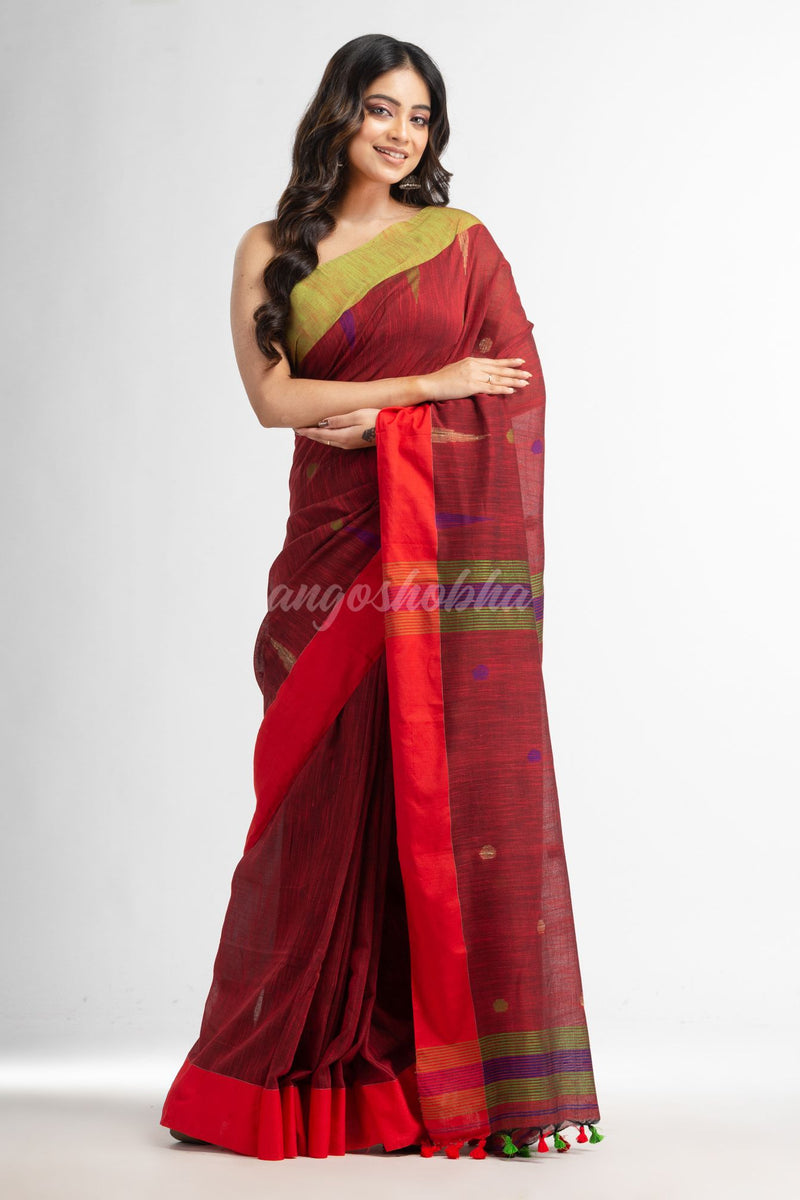 Rust all over ball Buti with Pallu in temple border handwoven saree