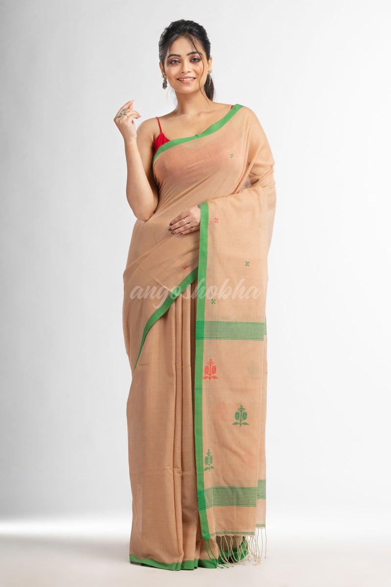 Biscuit all body buti with buti in green border handwoven cotton saree