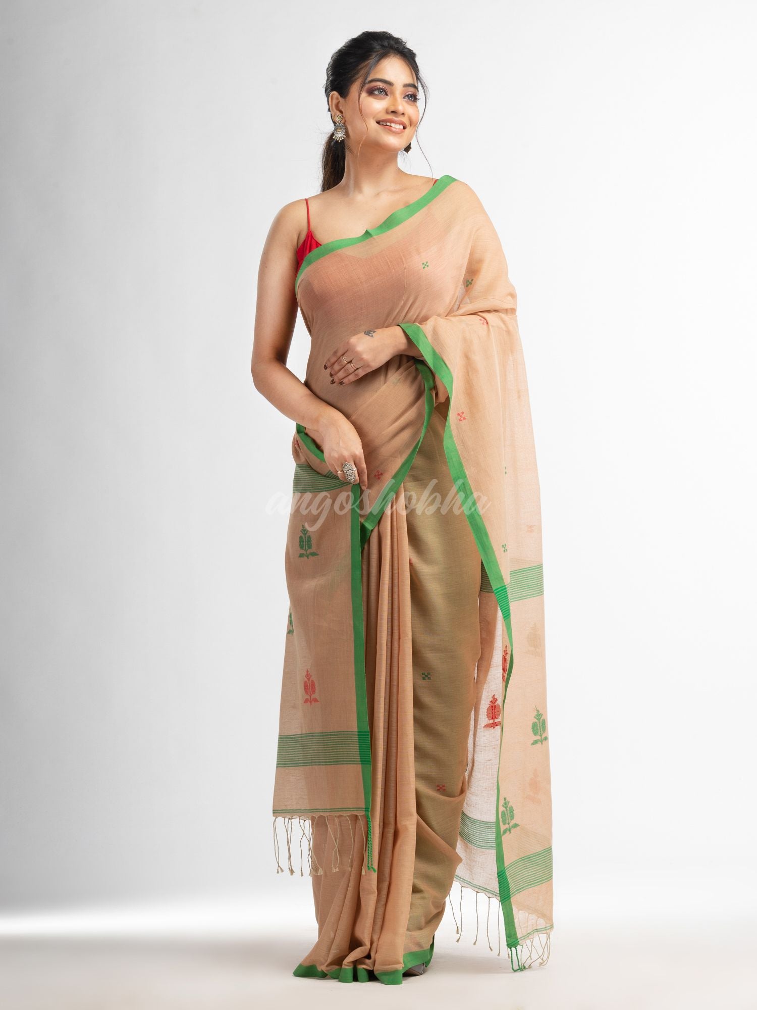 Biscuit all body buti with buti in green border handwoven cotton saree