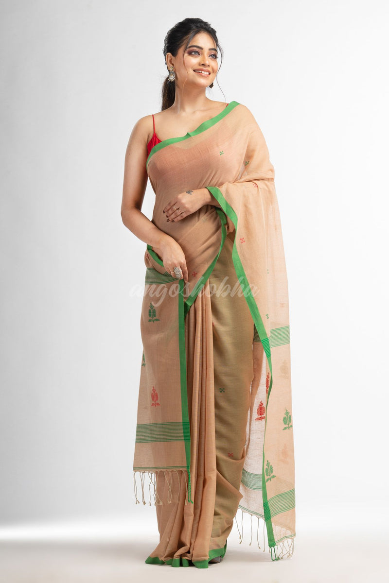 Biscuit all body buti with buti in green border handwoven cotton saree
