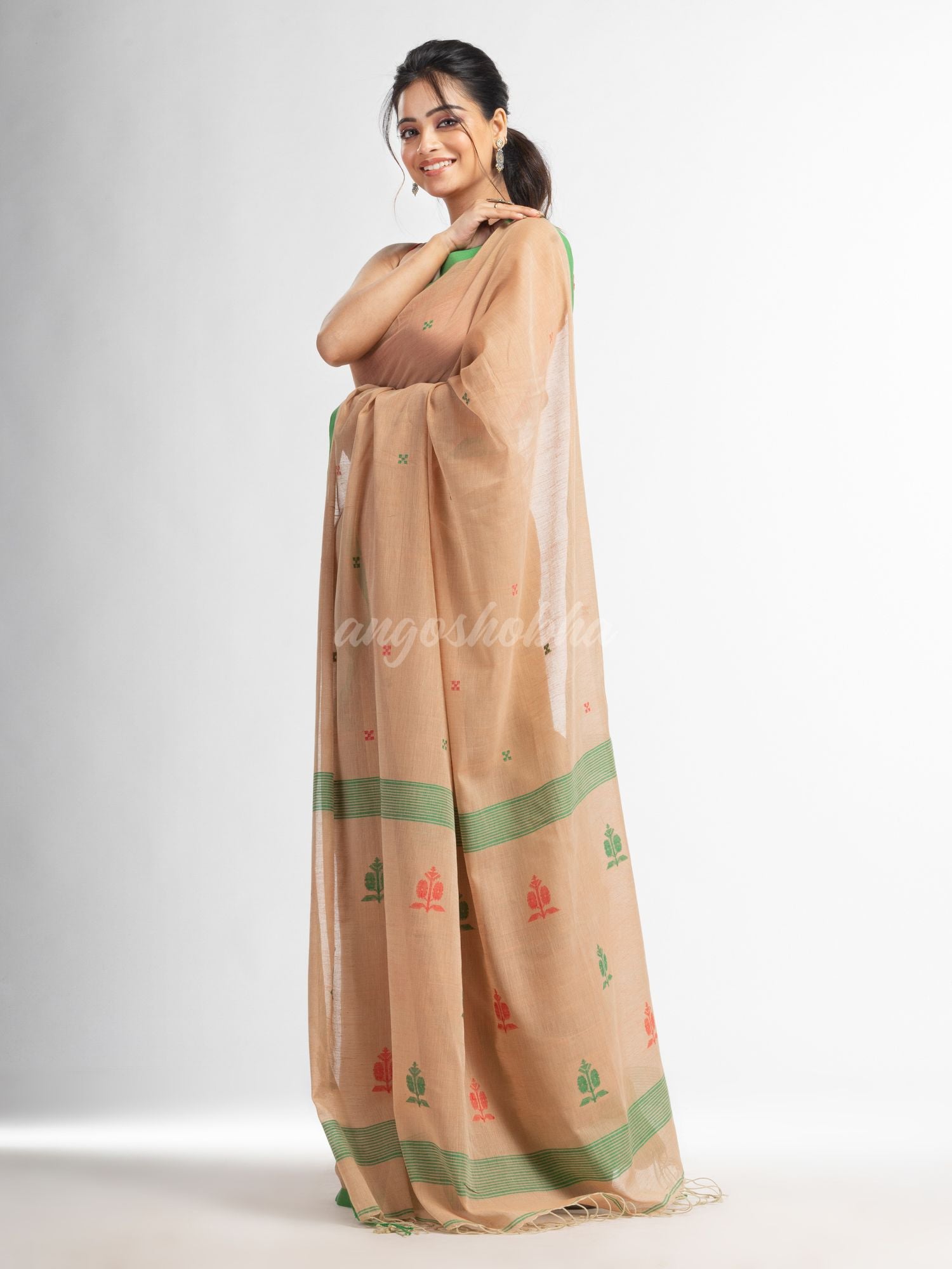 Biscuit all body buti with buti in green border handwoven cotton saree