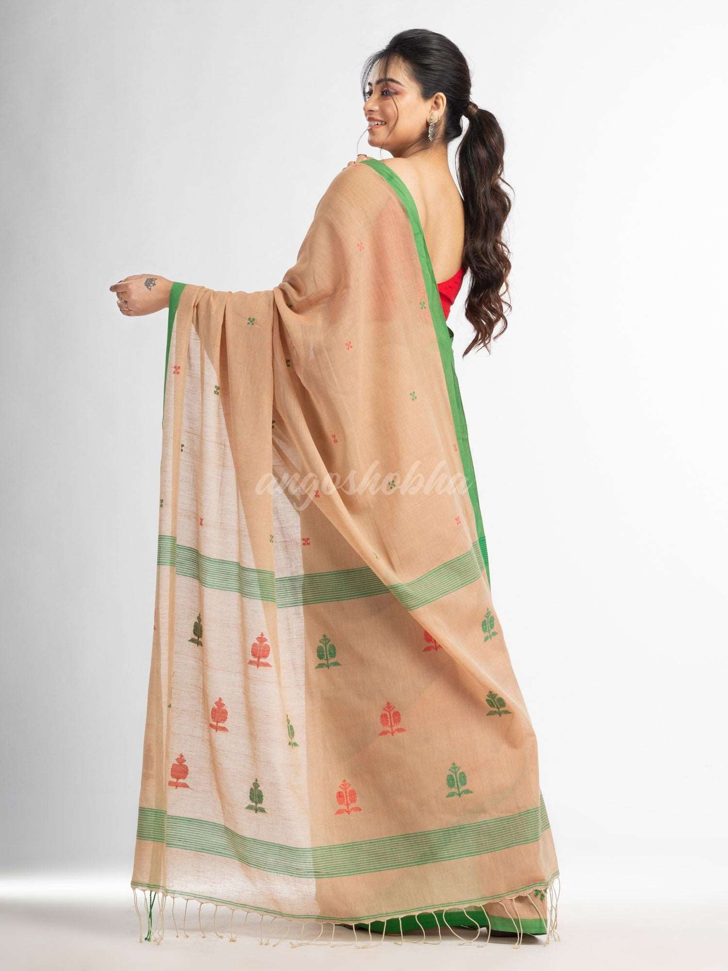 Biscuit all body buti with buti in green border handwoven cotton saree
