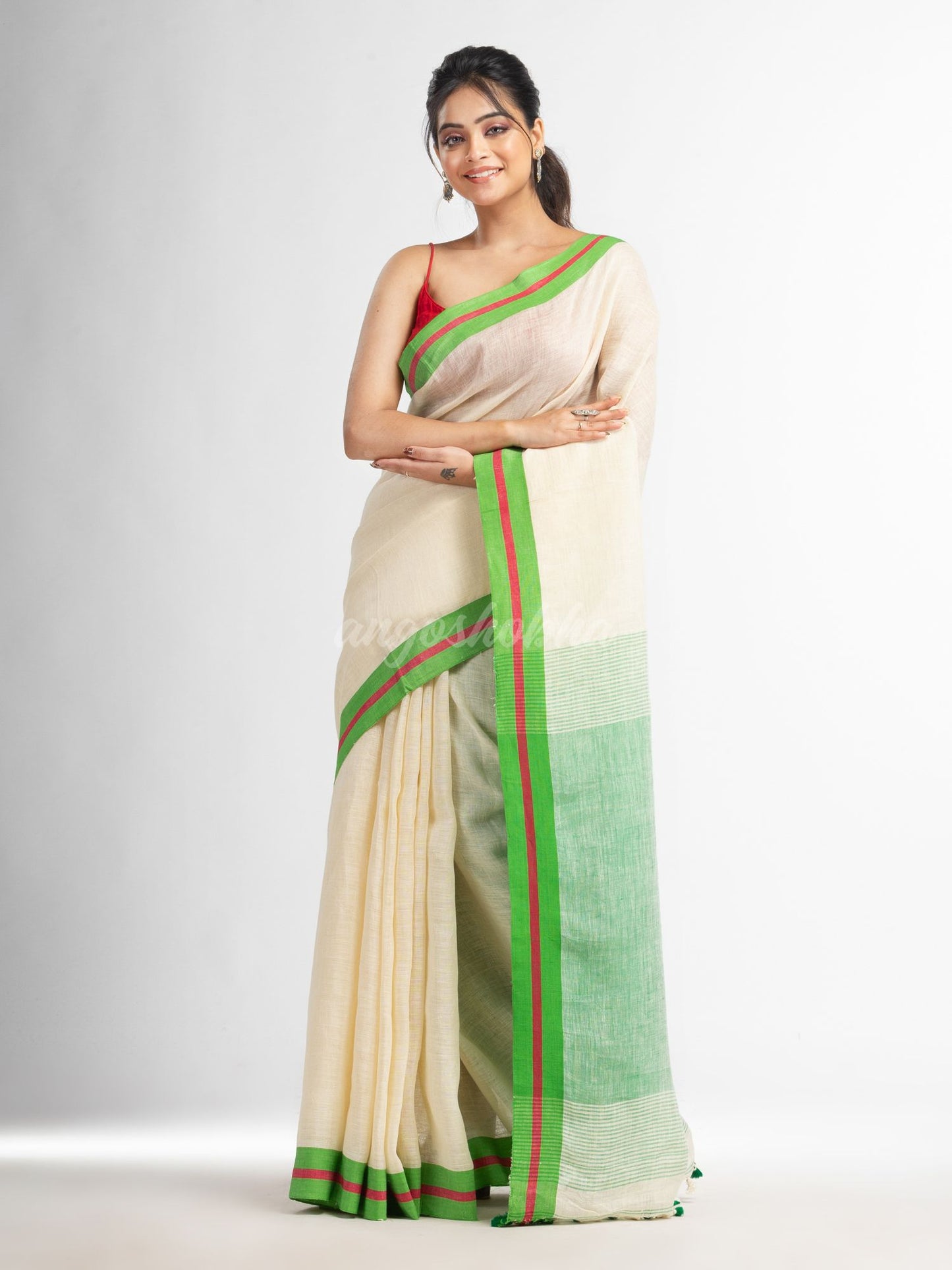 Cream with green pallu in multi colour boeder handwoven linen saree