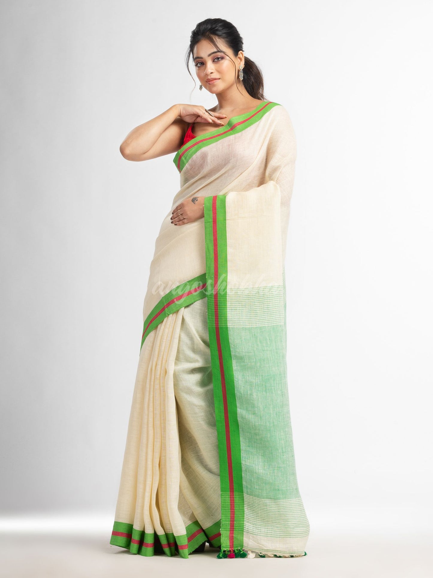 Cream with green pallu in multi colour boeder handwoven linen saree