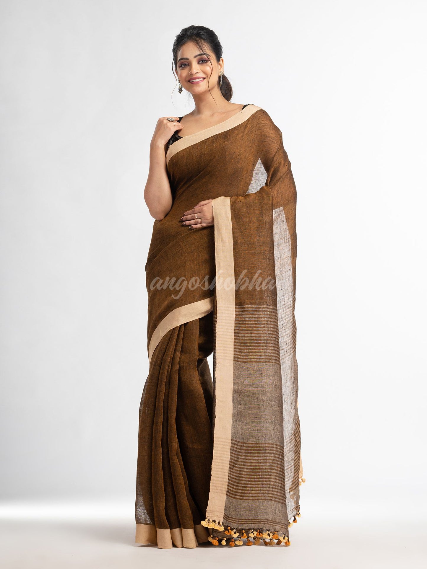 Brown with multi colour pallu in solit broder handwoven linen saree