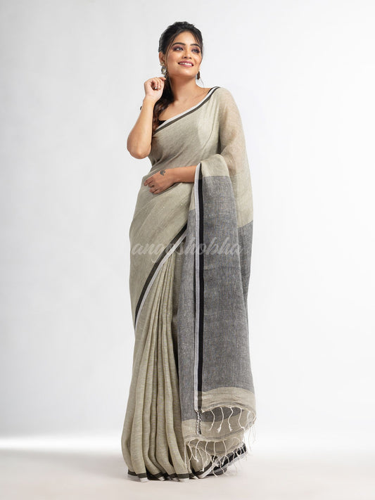 Sage green twill weaving with black pallu in white and black border handwoven linen saree