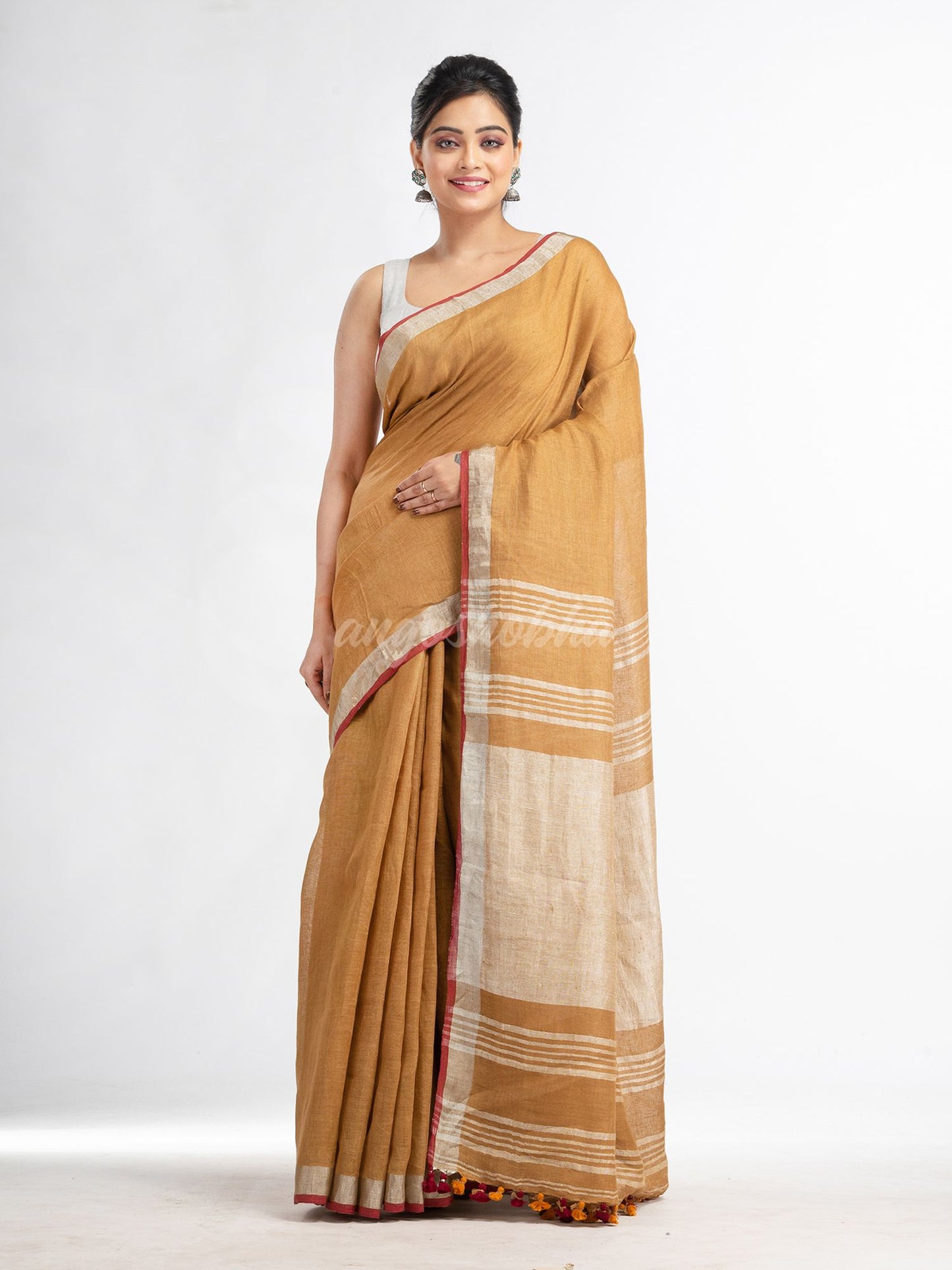 saffron with silver zari pallu in silver zari border handwoven linen saree