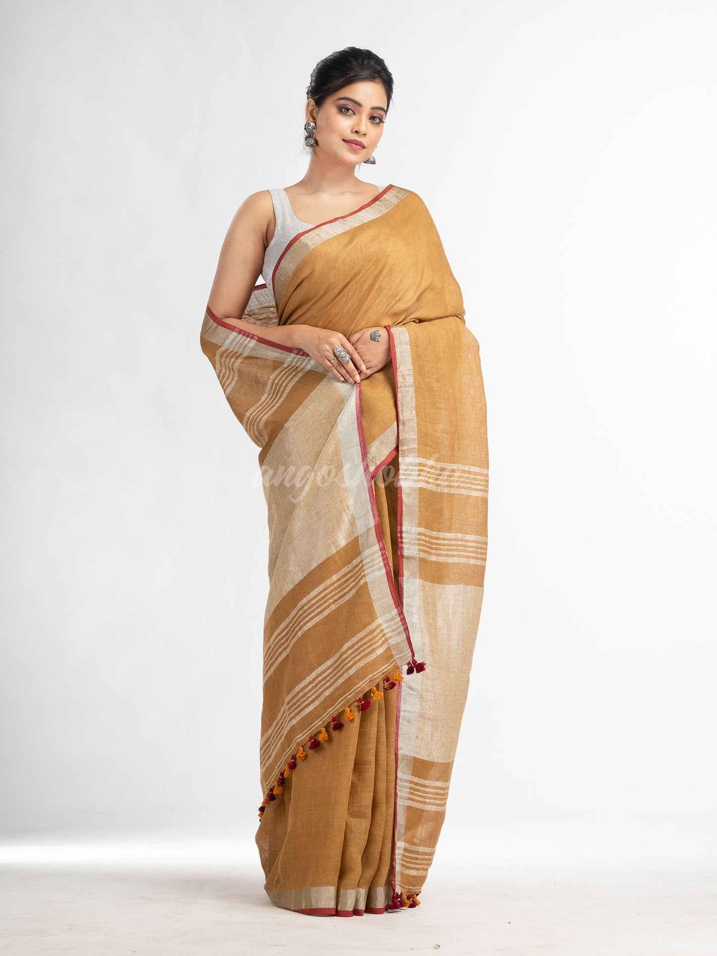 saffron with silver zari pallu in silver zari border handwoven linen saree