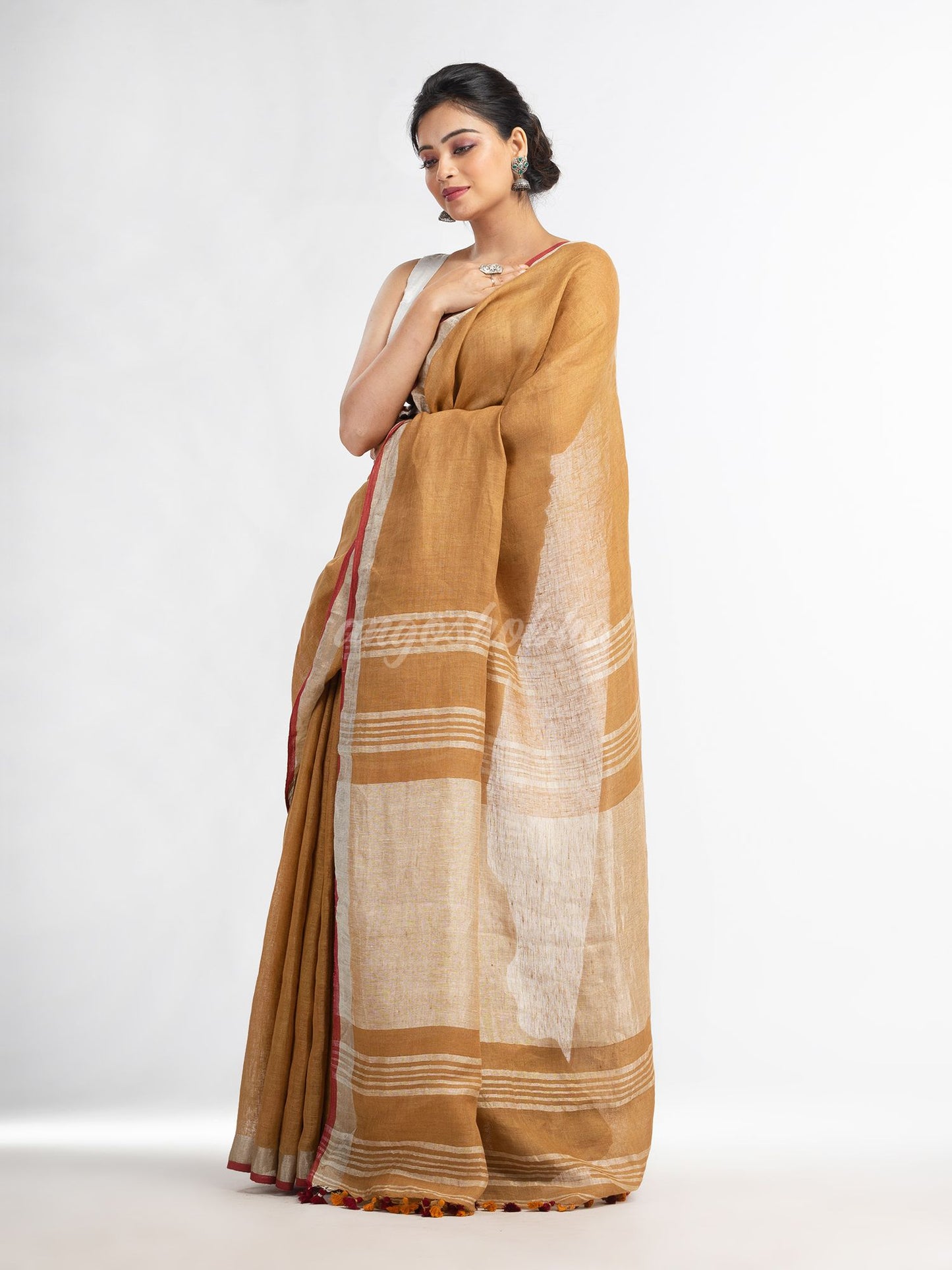 saffron with silver zari pallu in silver zari border handwoven linen saree