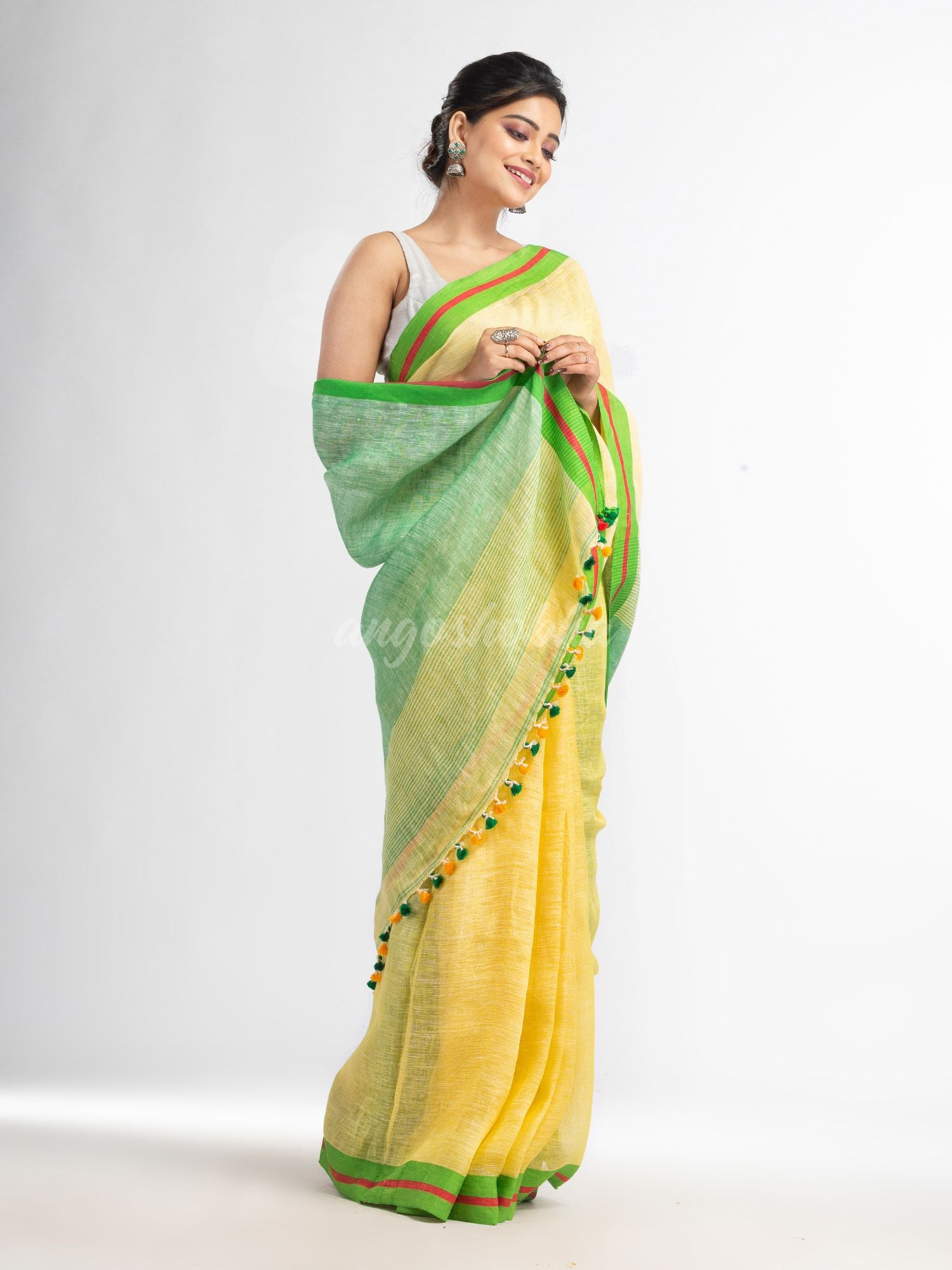 Yellow with green pallu in multi colour broder handwoven linen saree