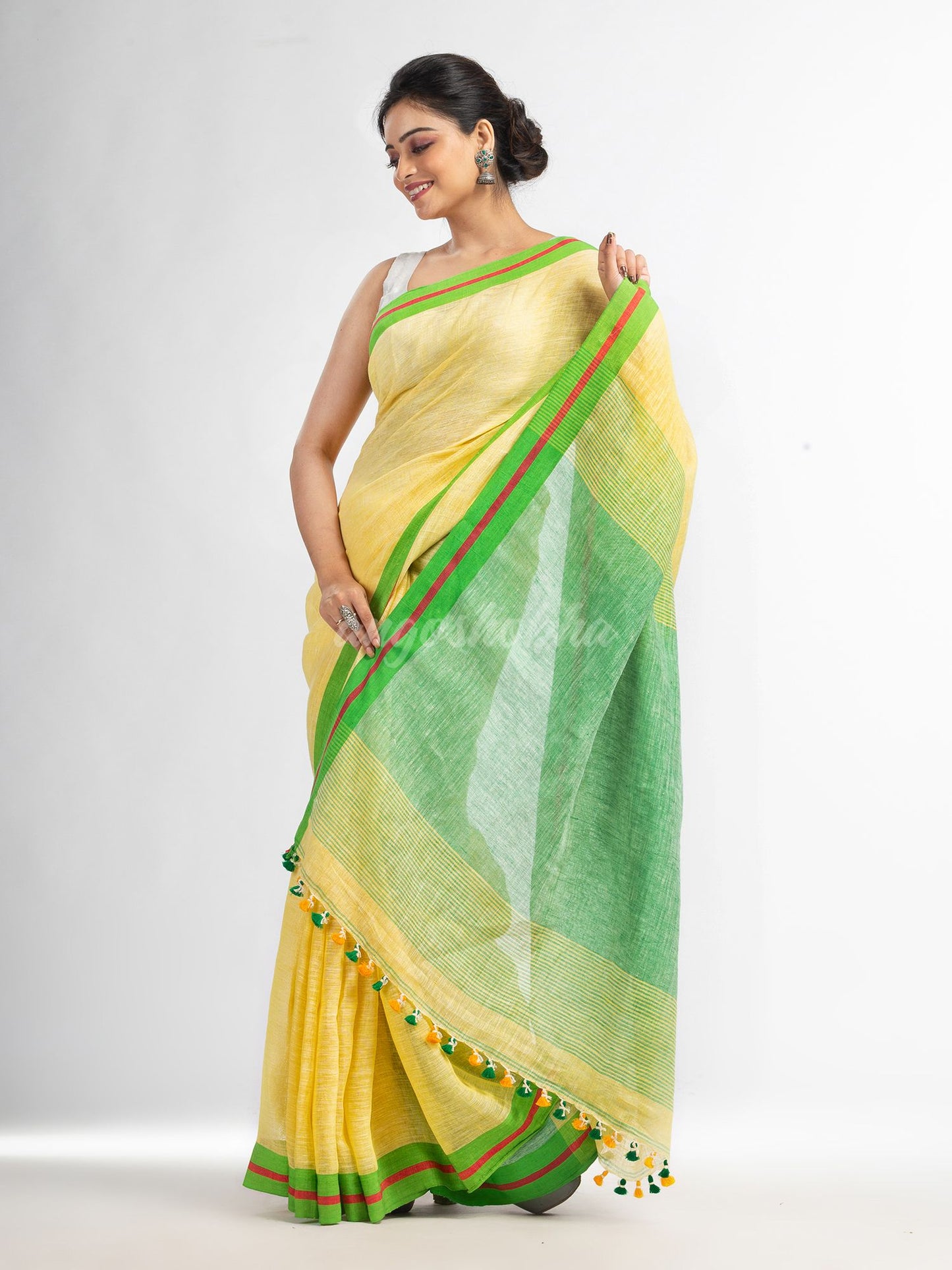 Yellow with green pallu in multi colour broder handwoven linen saree