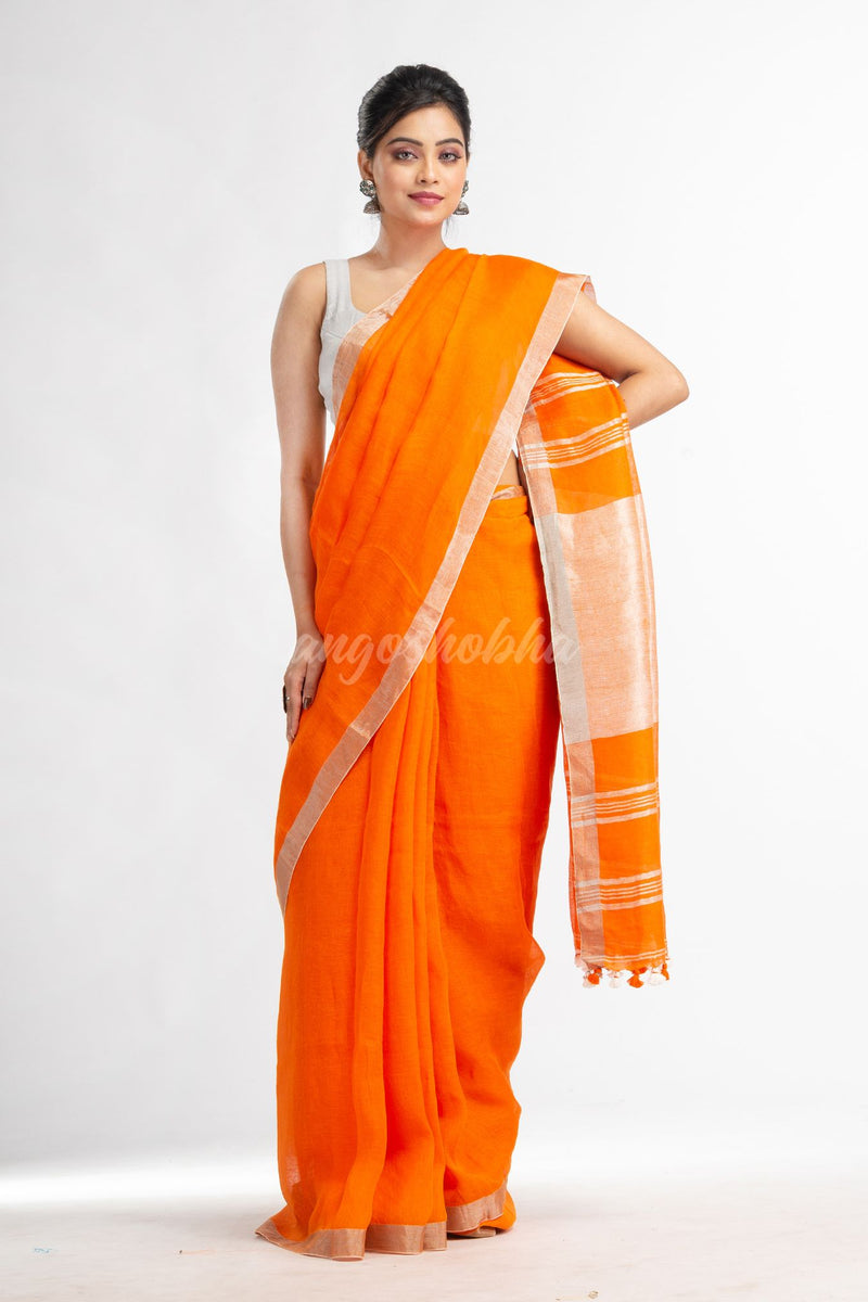 Orange with silver zari pallu in silver zari border handwoven linen saree