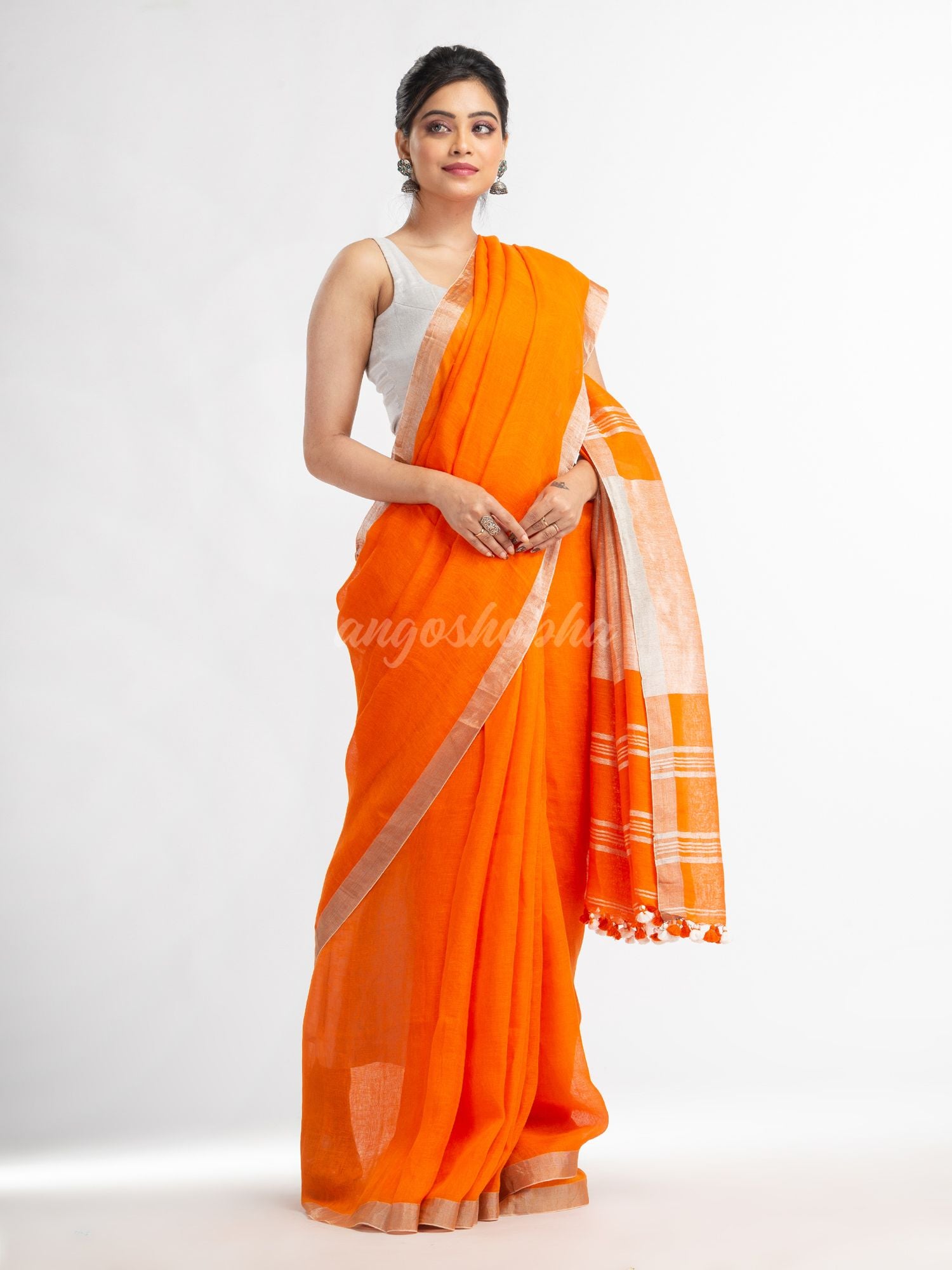 Orange with silver zari pallu in silver zari border handwoven linen saree