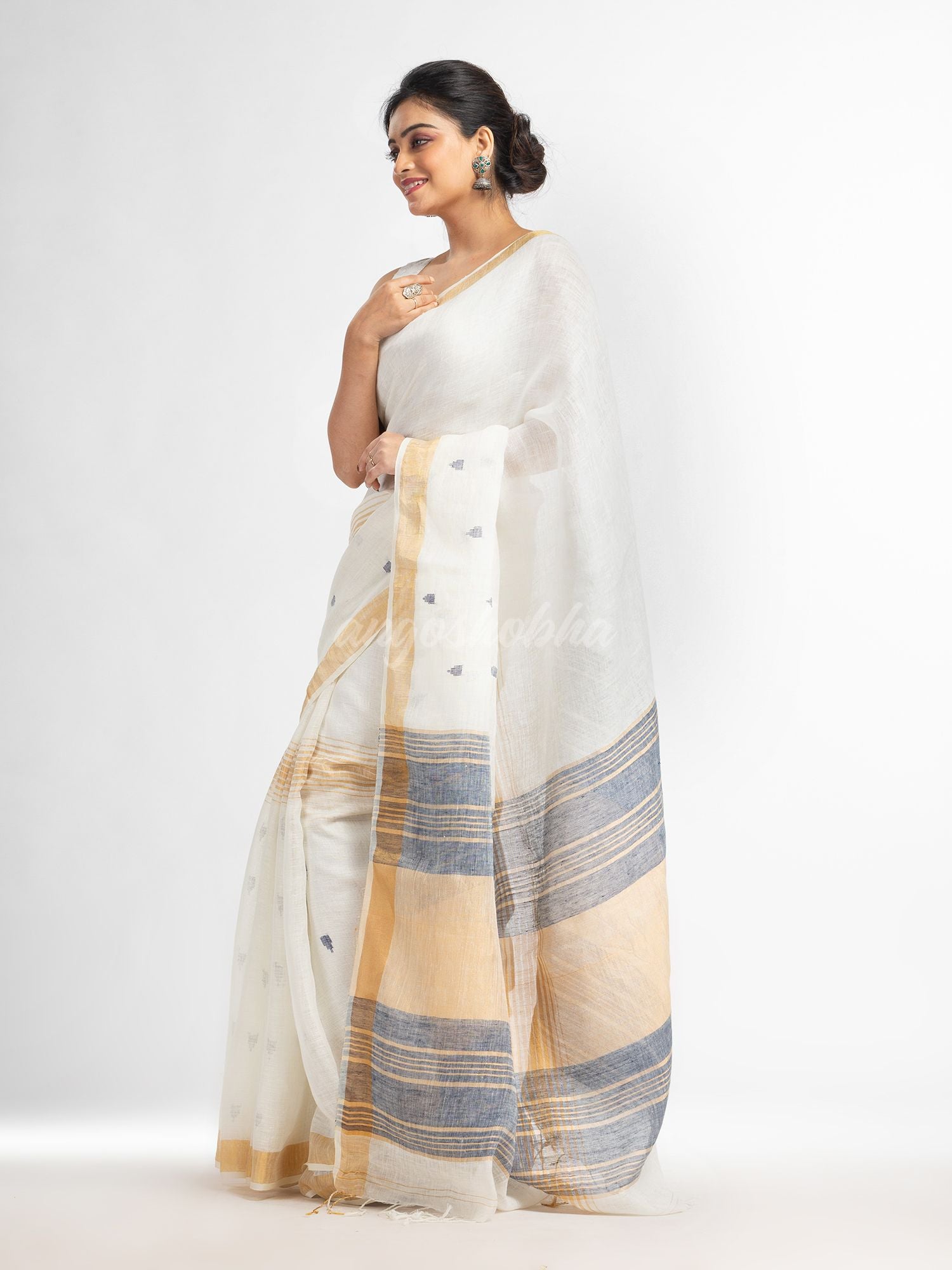 white half body buti with gold zari and navy blue pallu in gold zari border handwoven linen saree