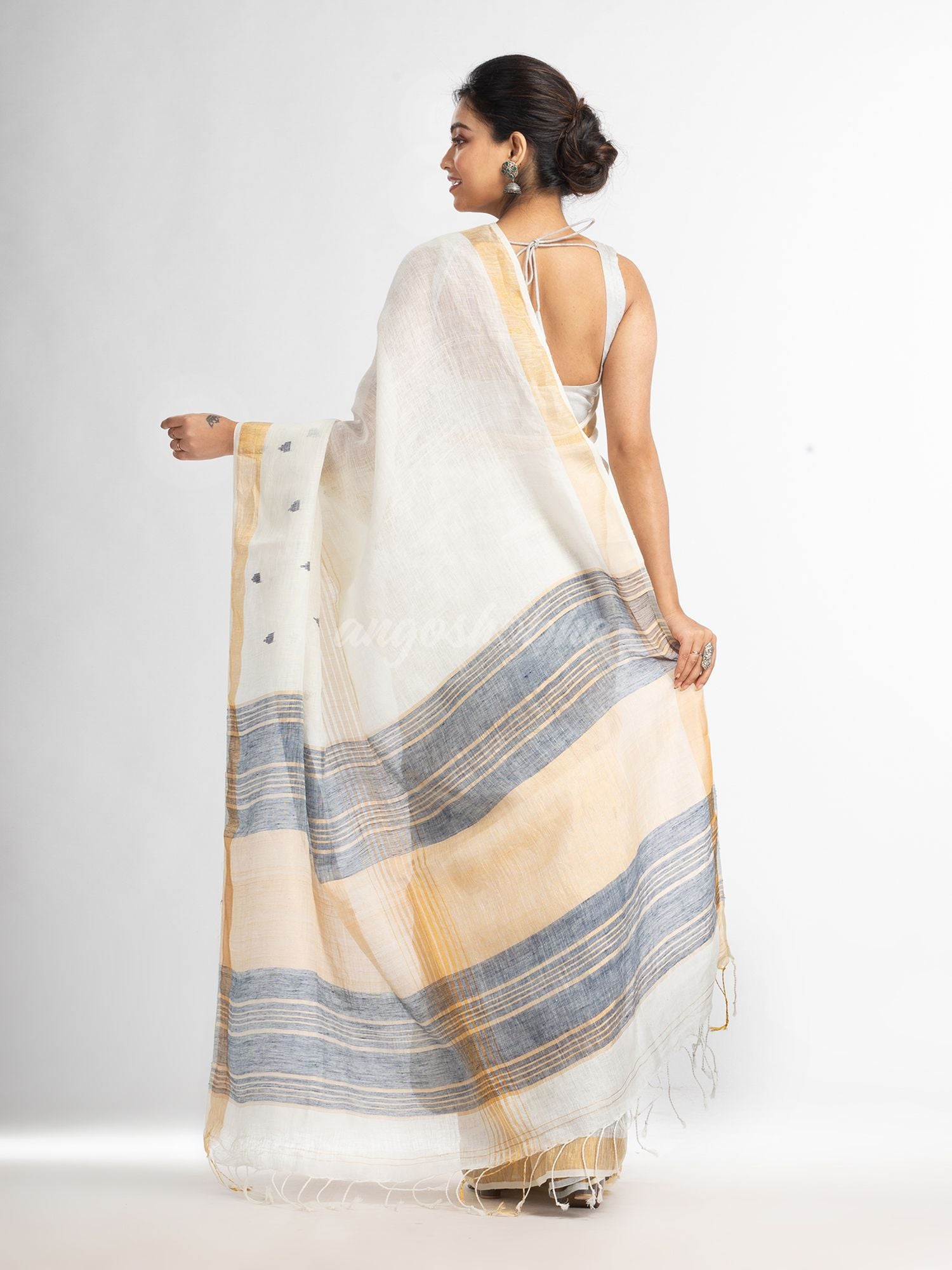 white half body buti with gold zari and navy blue pallu in gold zari border handwoven linen saree