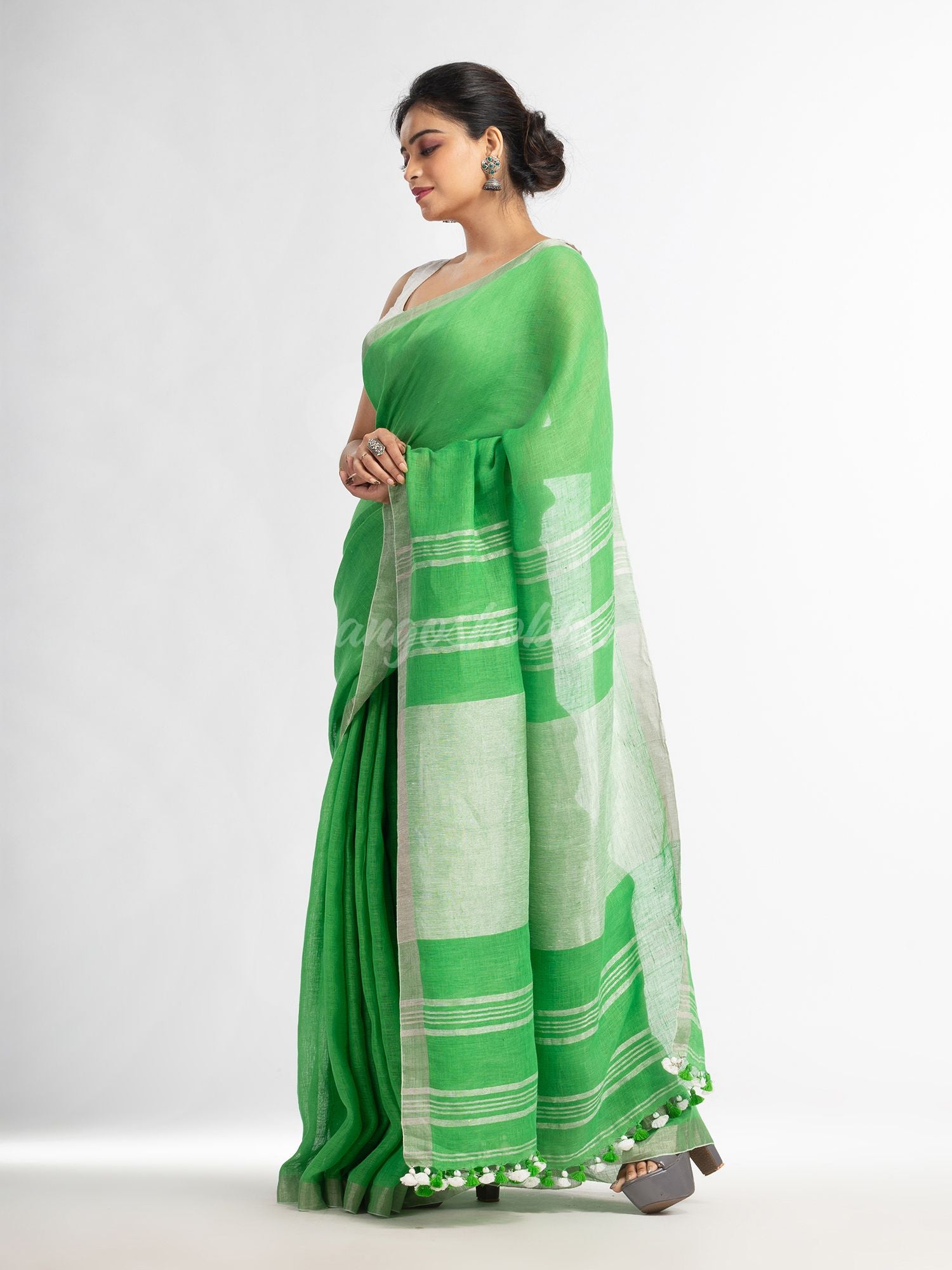 Green with silver zari pallu in silver zari border handwoven linen saree