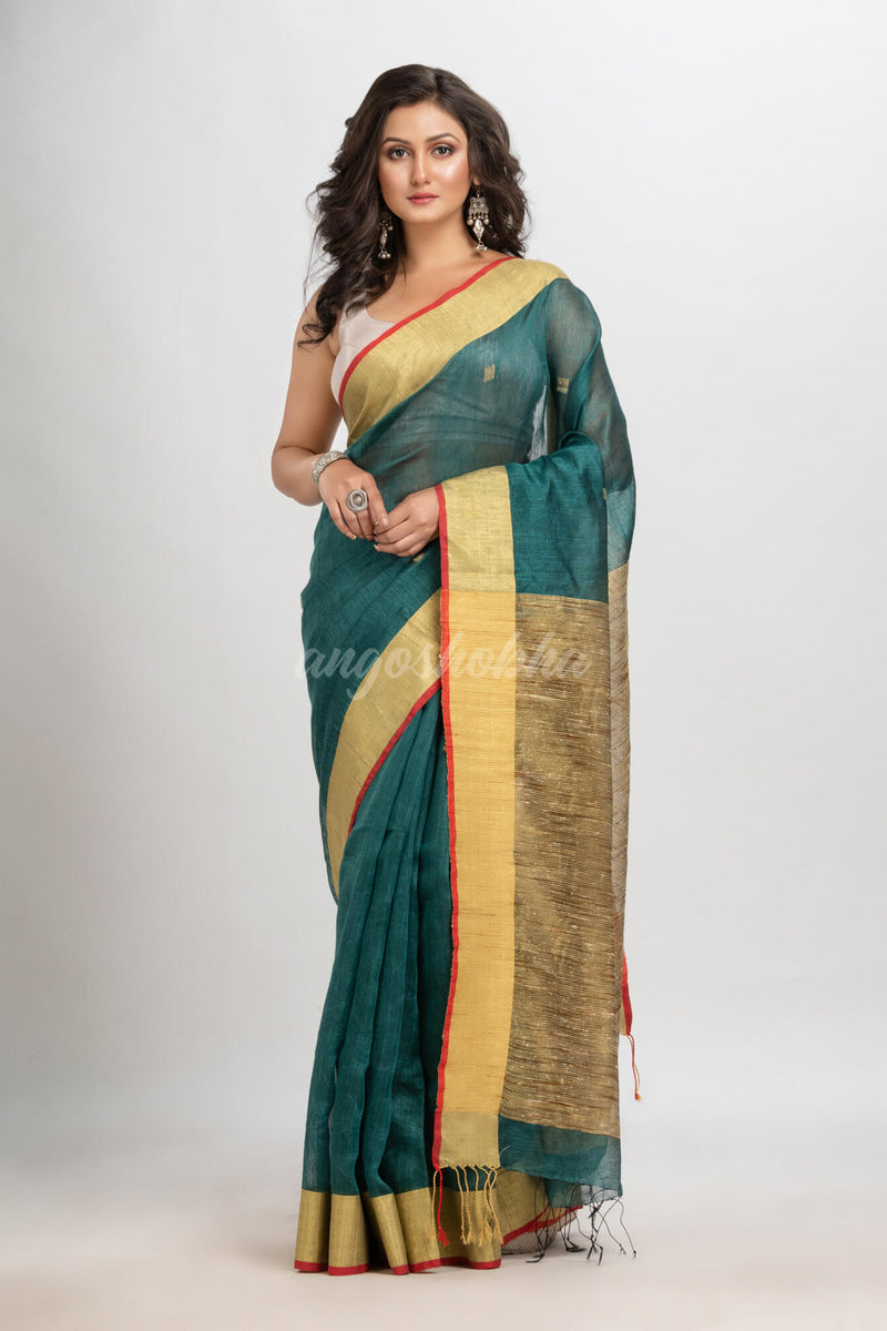 Dark teal silk blend linen with  solid border jamdani saree