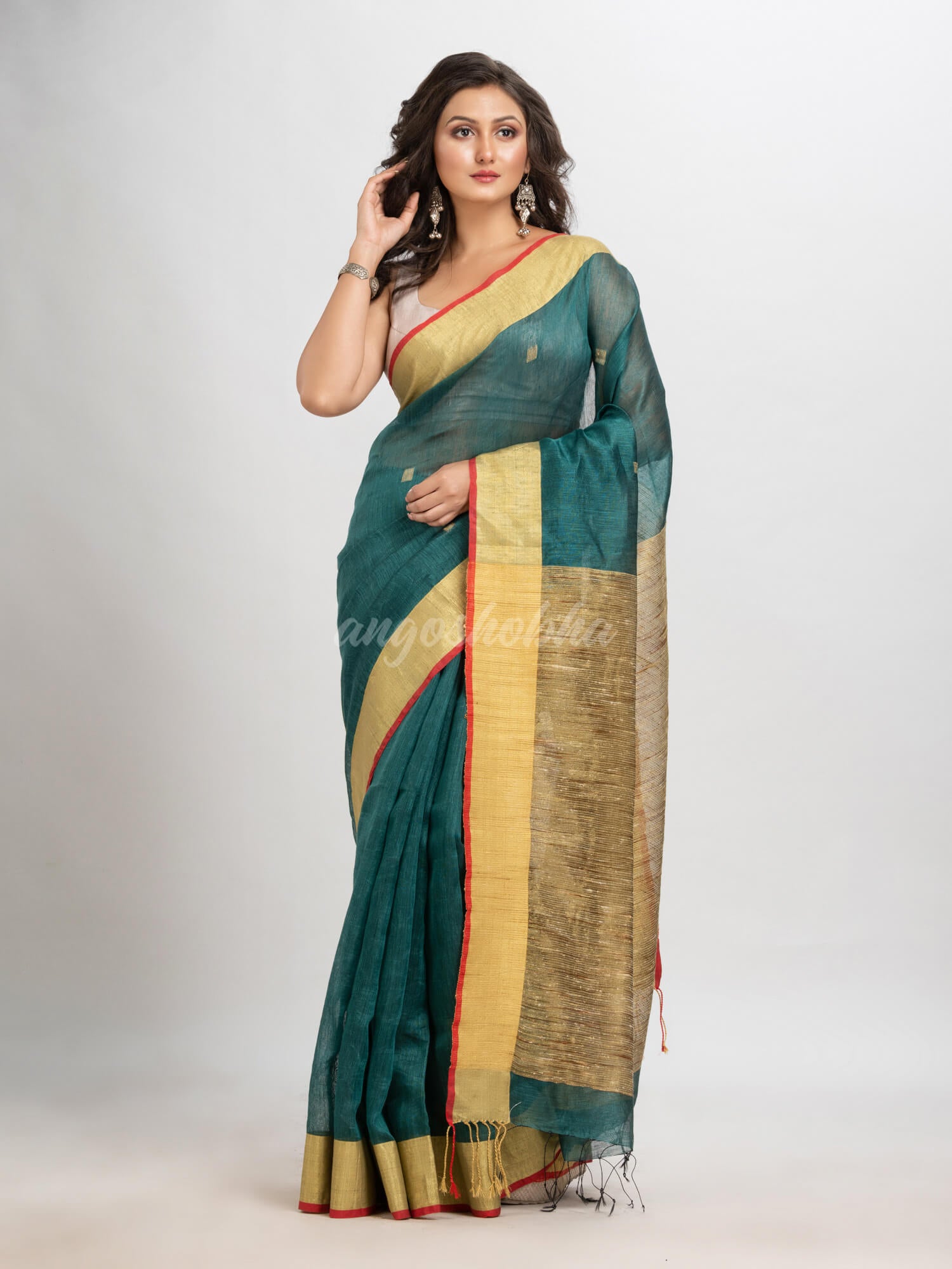 Dark teal silk blend linen with  solid border jamdani saree