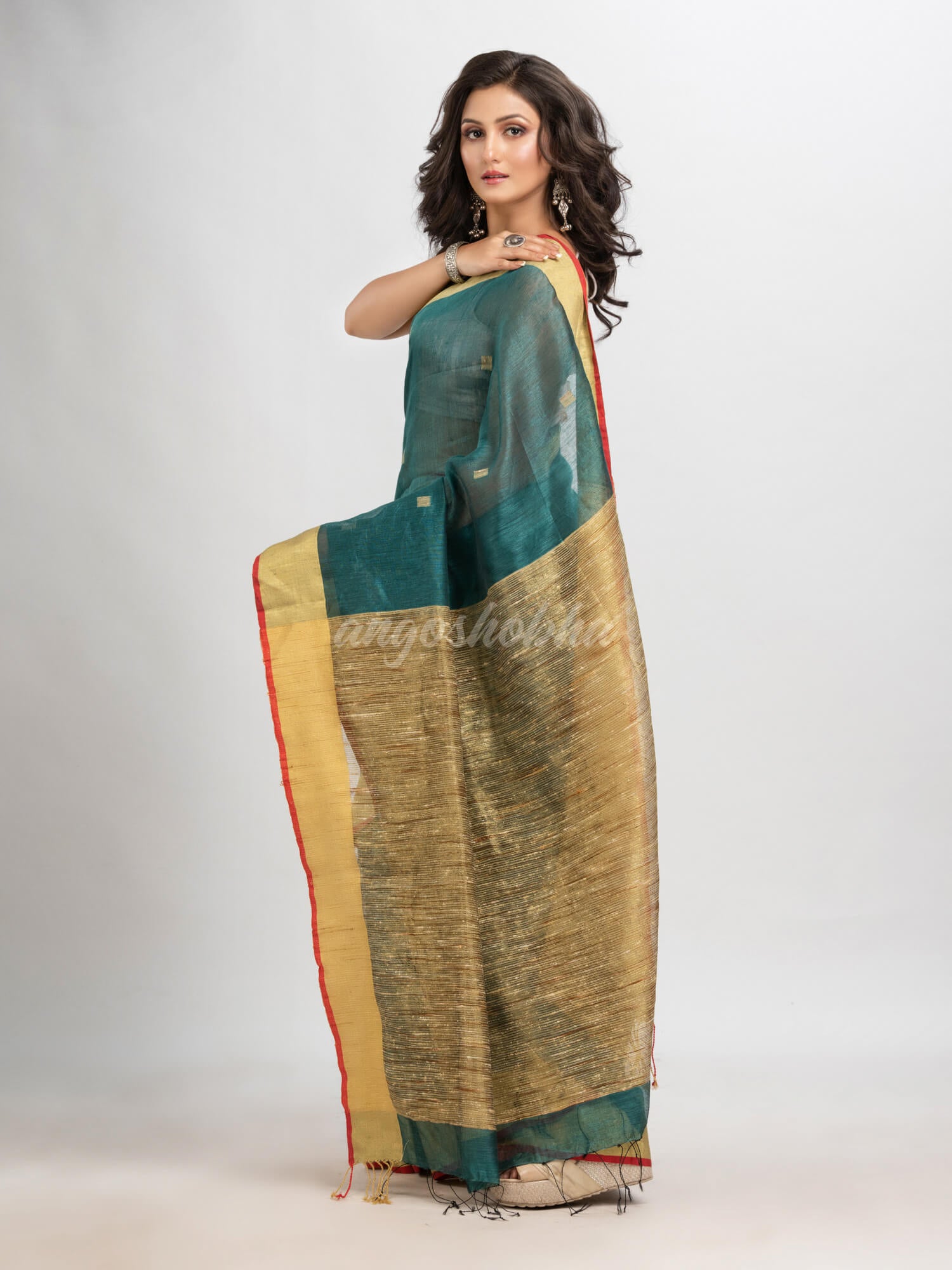 Dark teal silk blend linen with  solid border jamdani saree