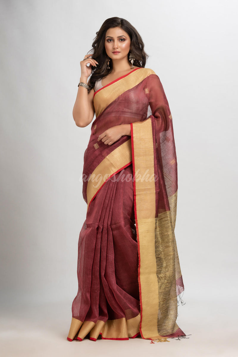 Umber brown silk blend linen with  solid border jamdani saree