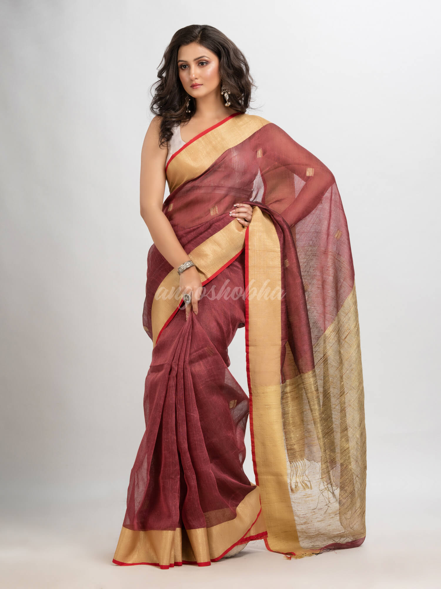 Umber brown silk blend linen with  solid border jamdani saree