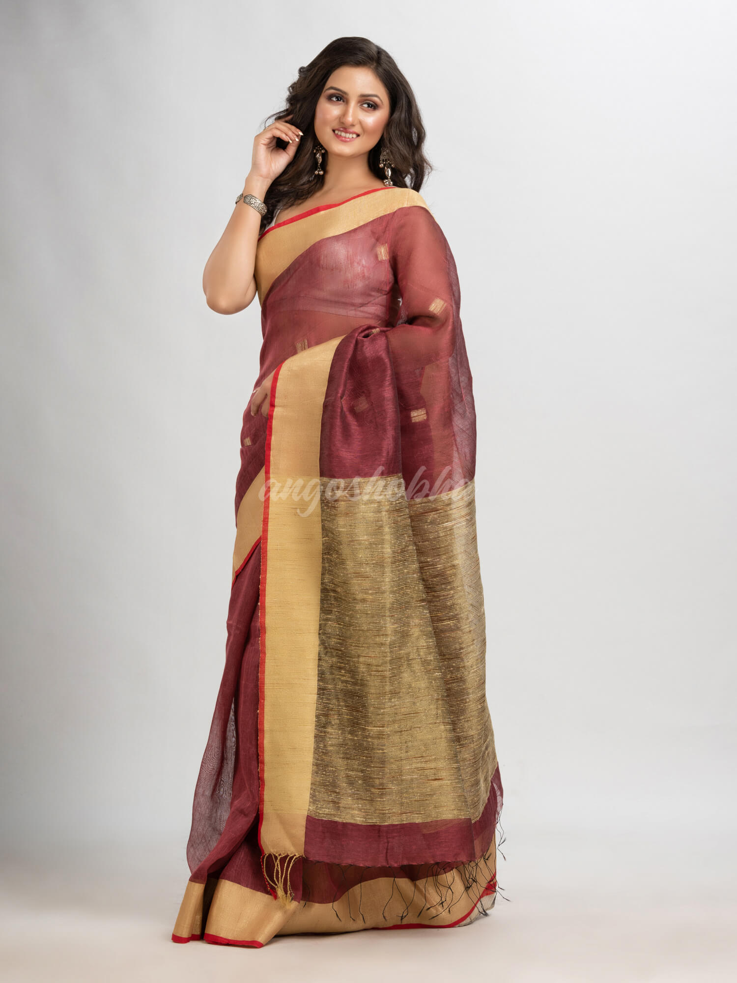 Umber brown silk blend linen with  solid border jamdani saree