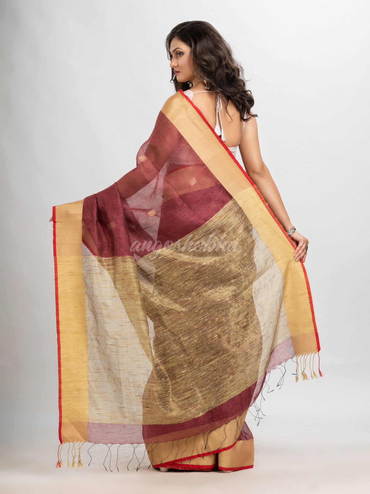 Umber brown silk blend linen with  solid border jamdani saree