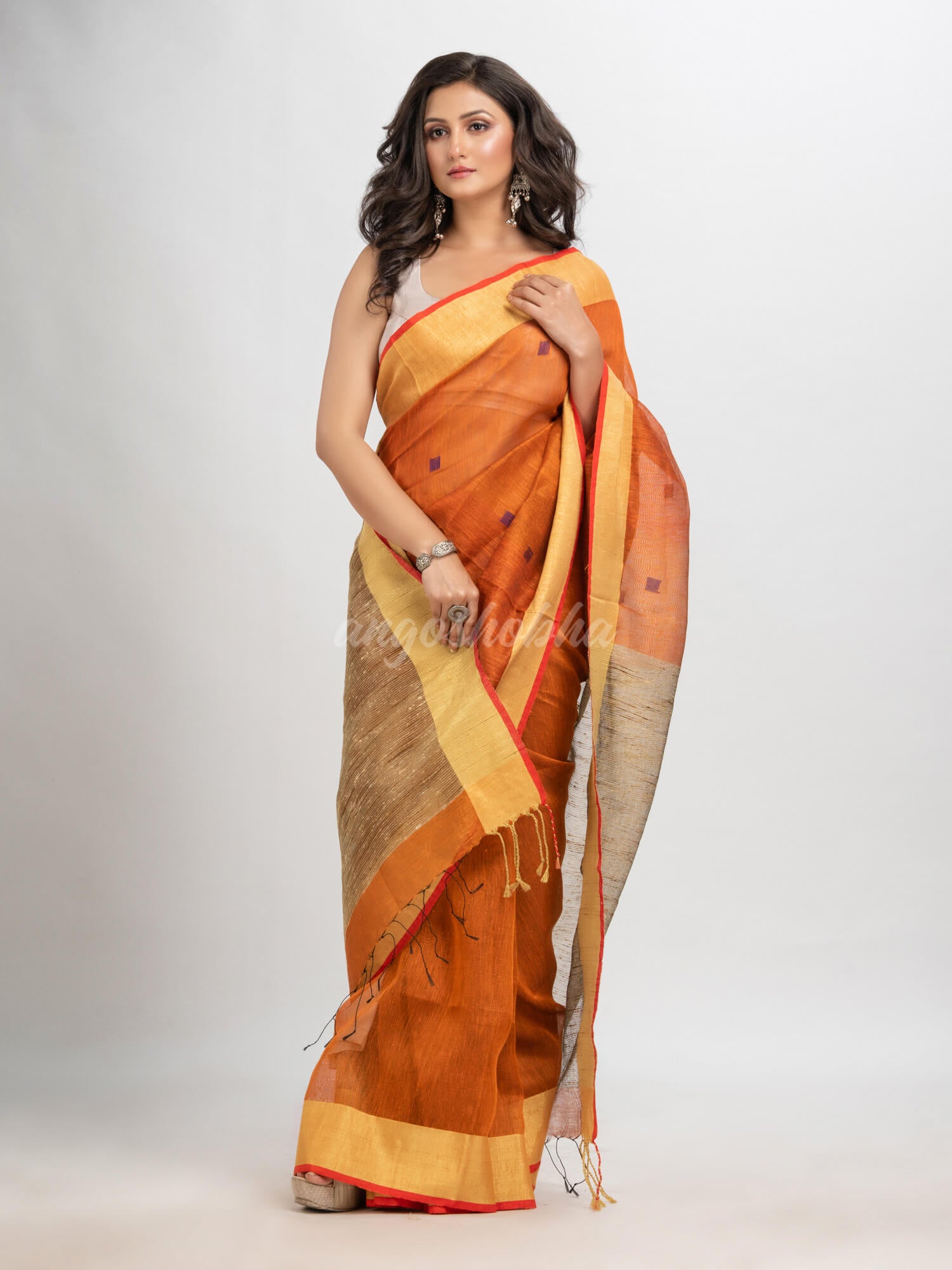 Russet silk blend linen with  solid border jamdani saree