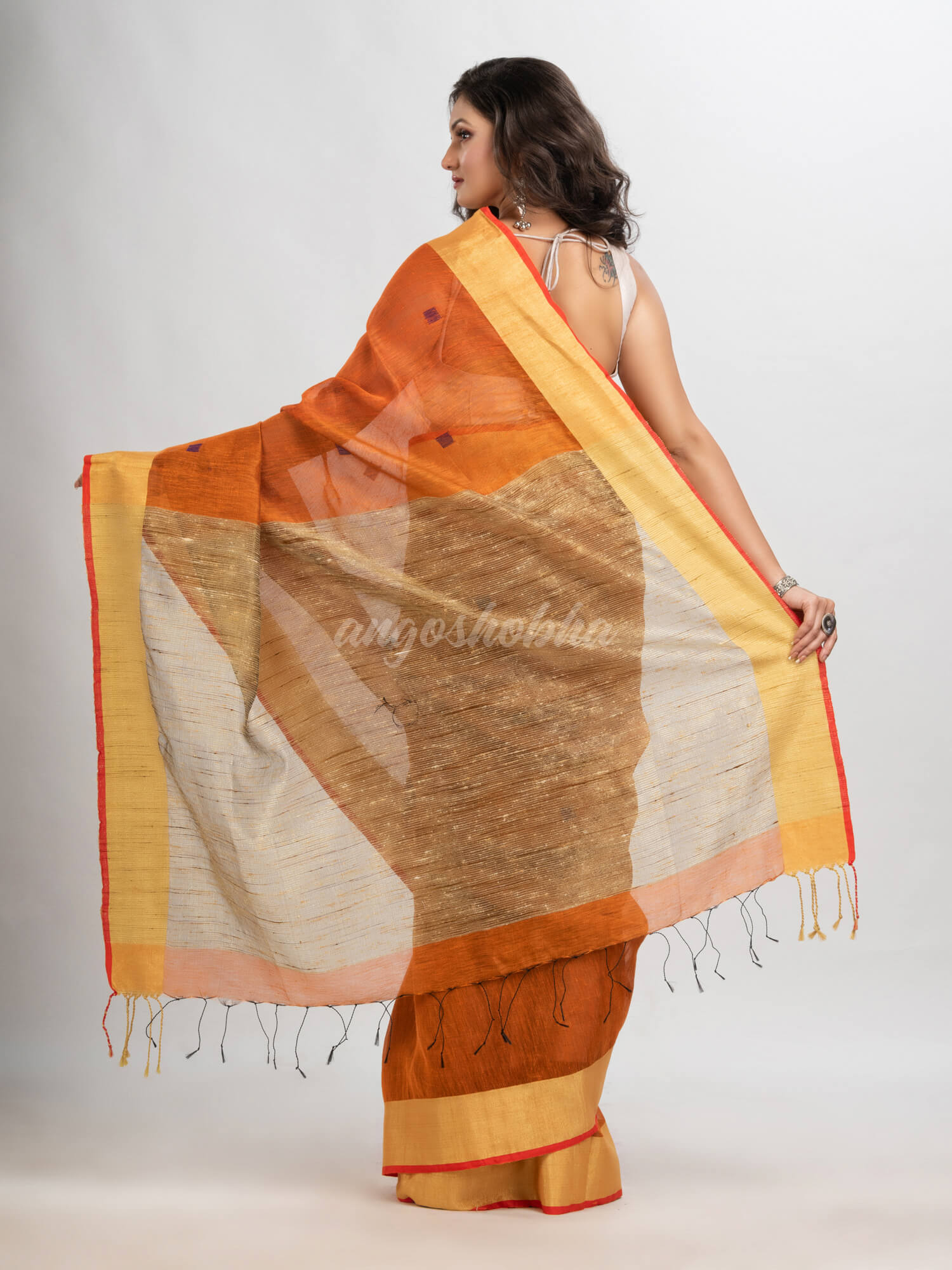 Russet silk blend linen with  solid border jamdani saree