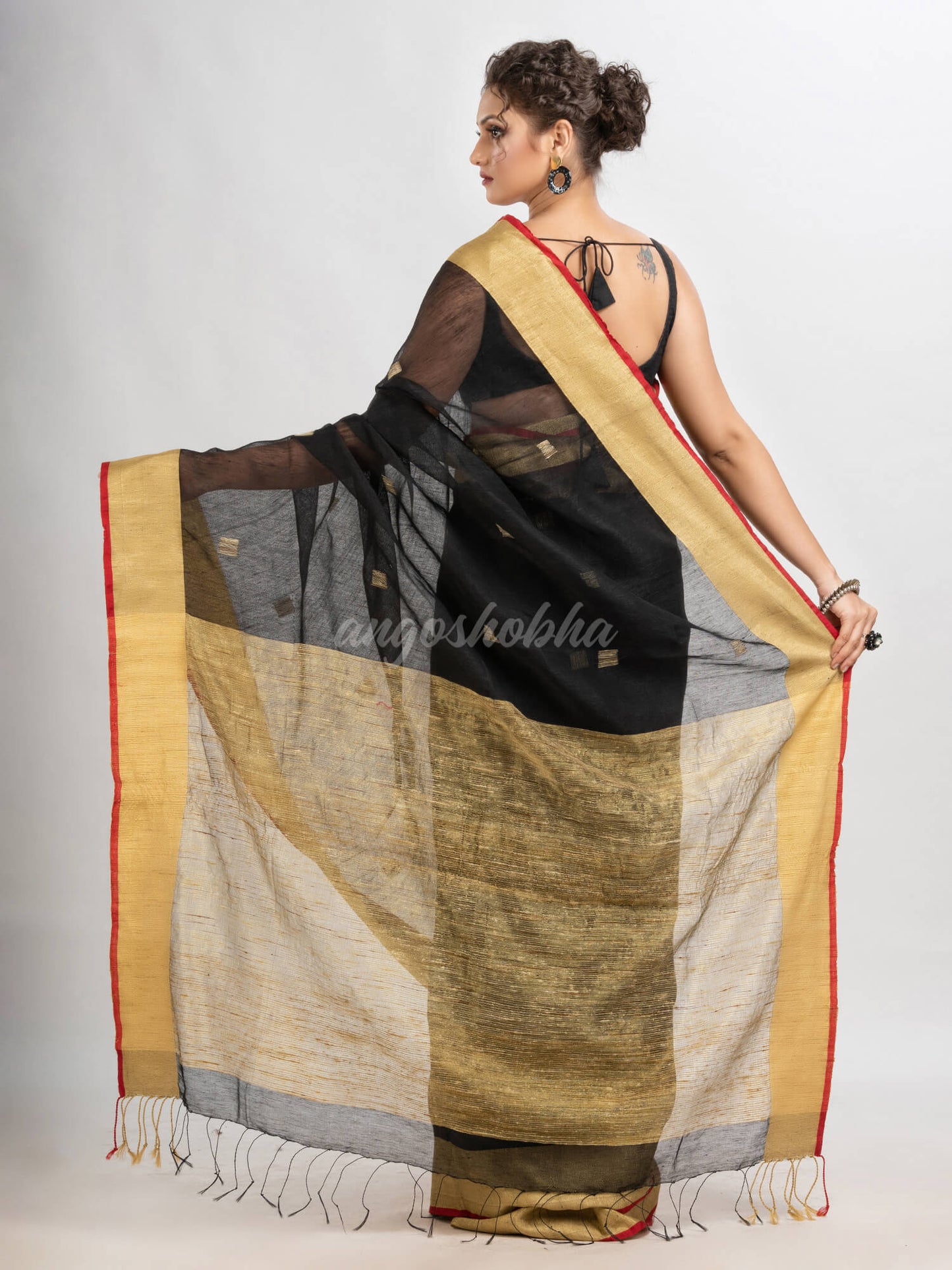 Black silk blend linen with  solid border jamdani saree