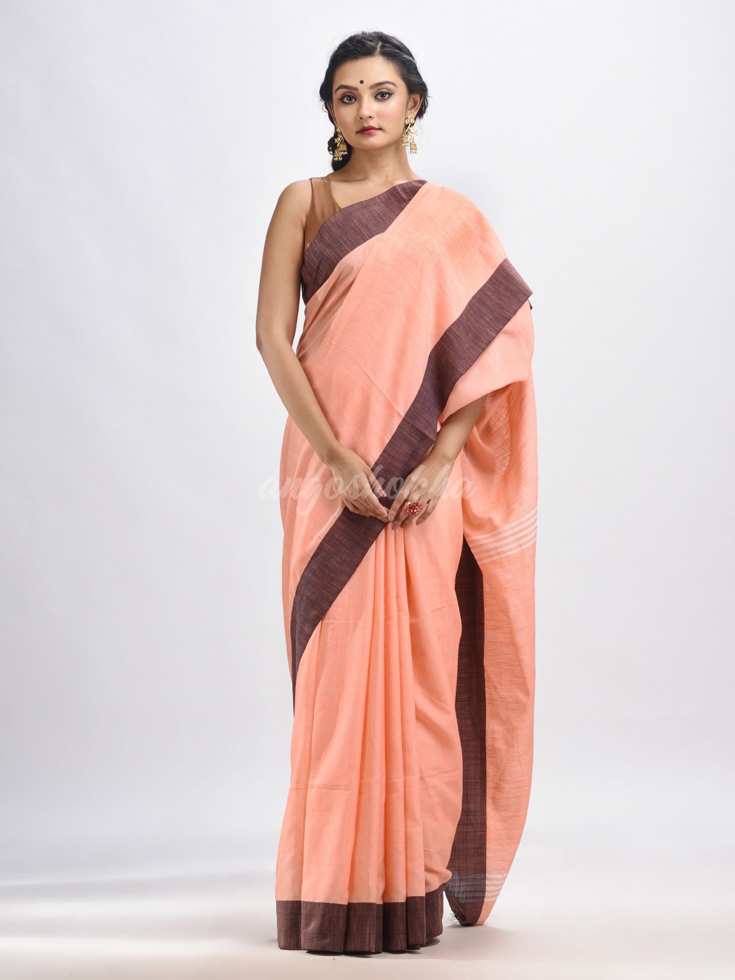 Peach cotton solid body handloom saree