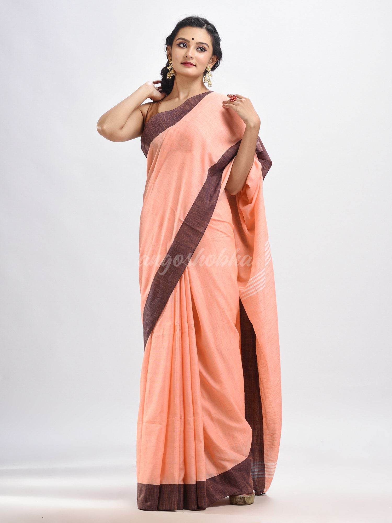 Peach cotton solid body handloom saree
