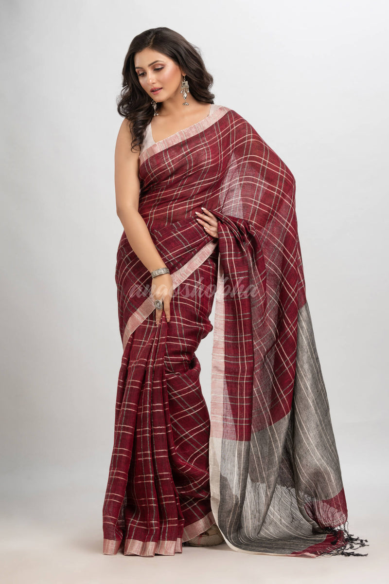 Maroon linen with silver zari  pallu handloom saree