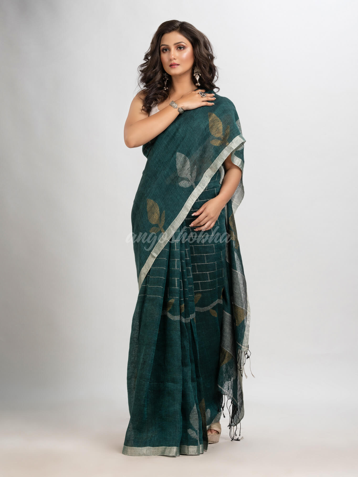 Dark bottle  green linen with zari border jamdani saree