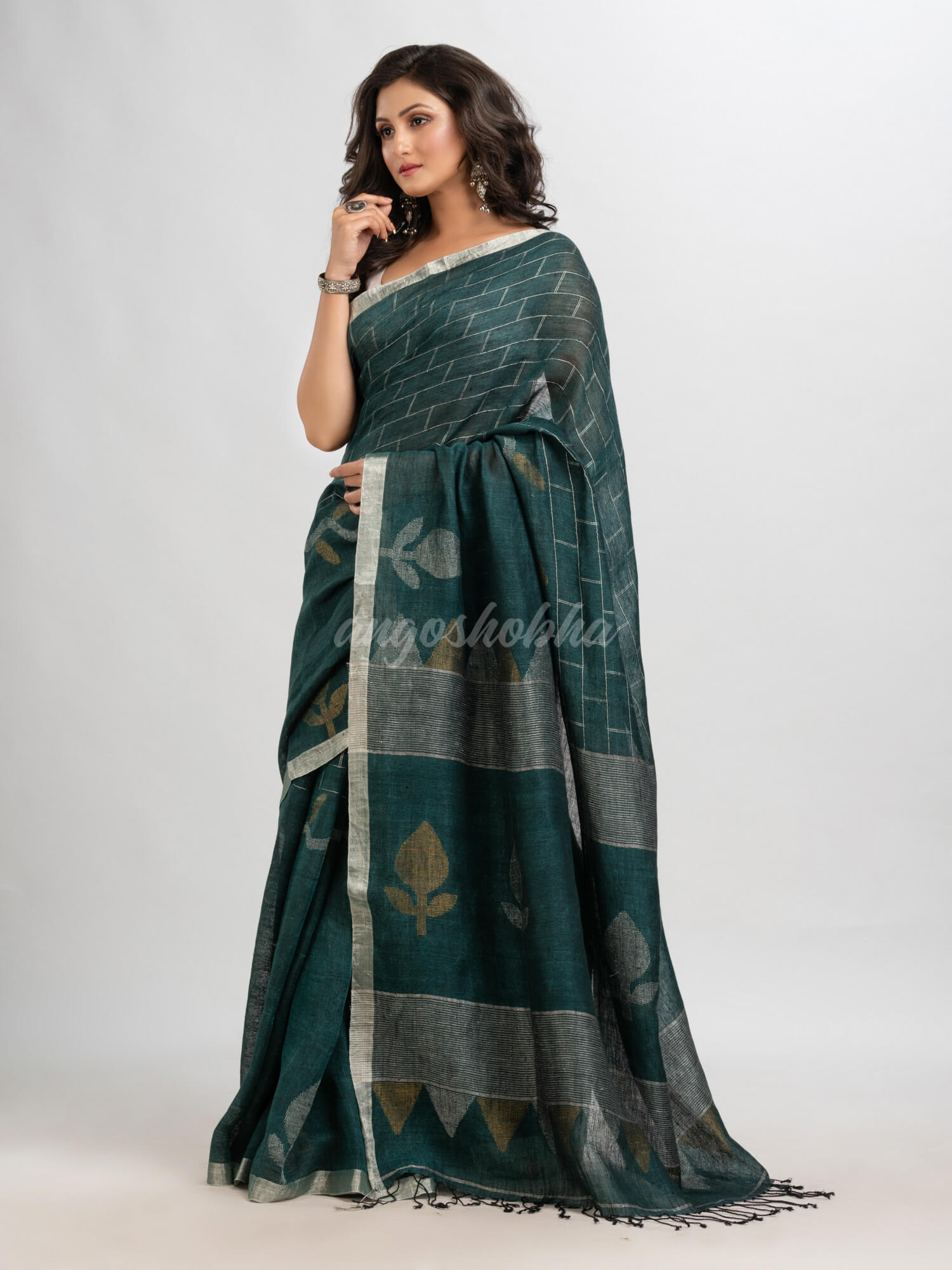 Dark bottle  green linen with zari border jamdani saree