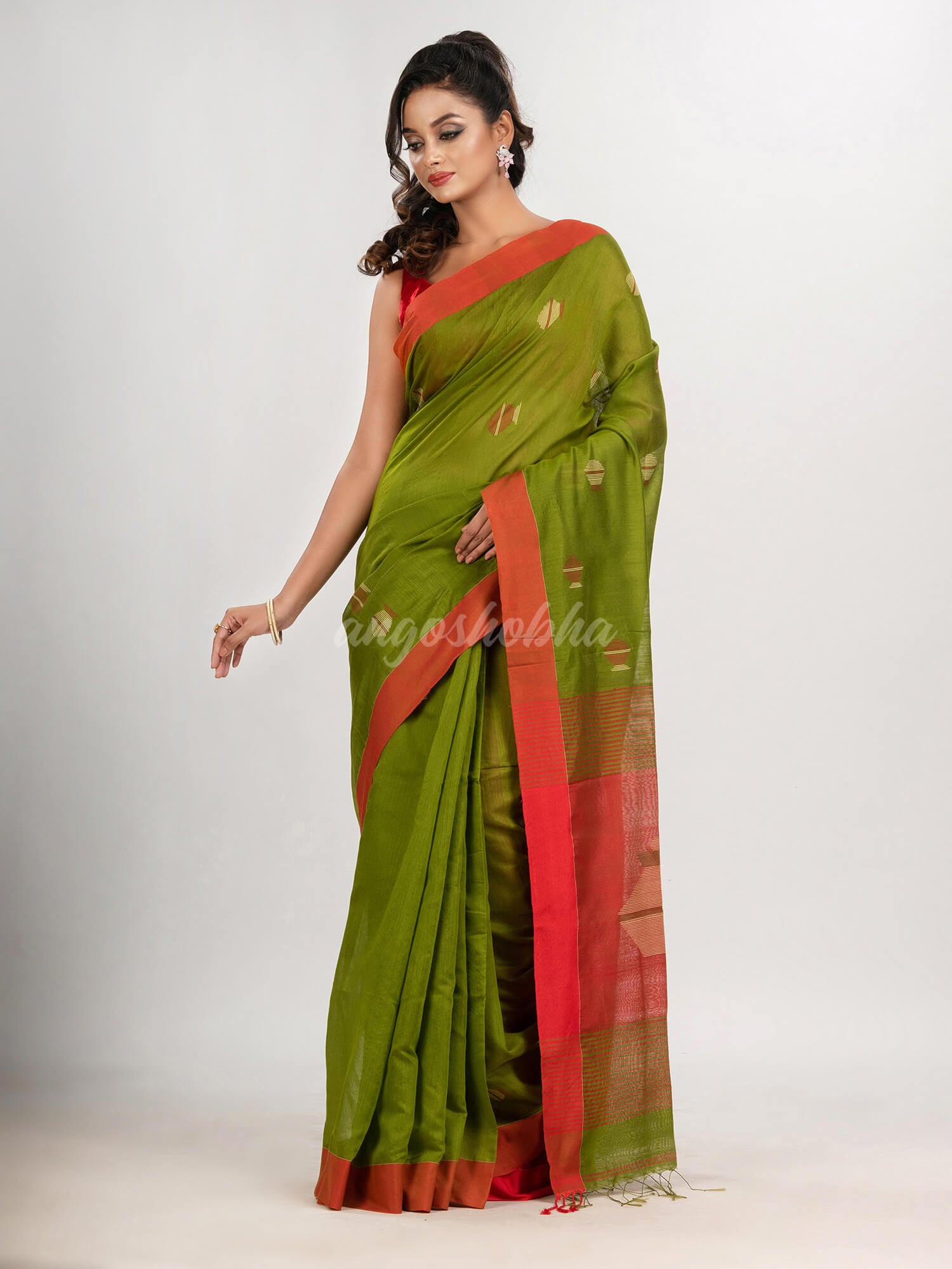 Venom green cotton blend all body noddle motive with red pallu jamdani saree