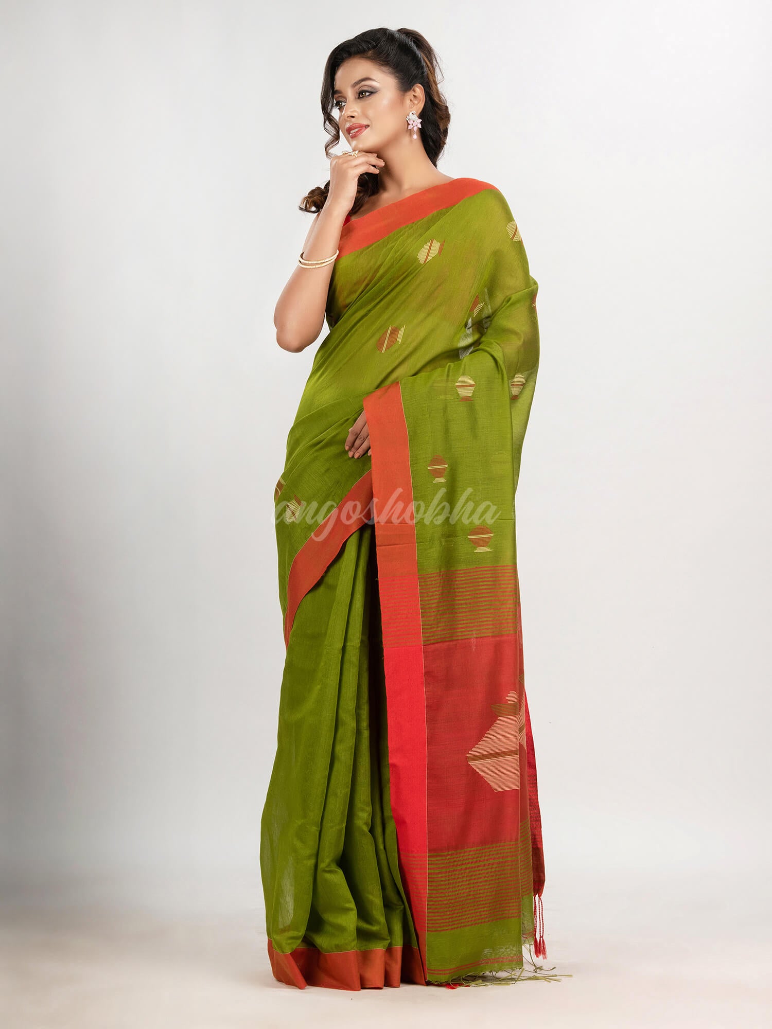 Venom green cotton blend all body noddle motive with red pallu jamdani saree