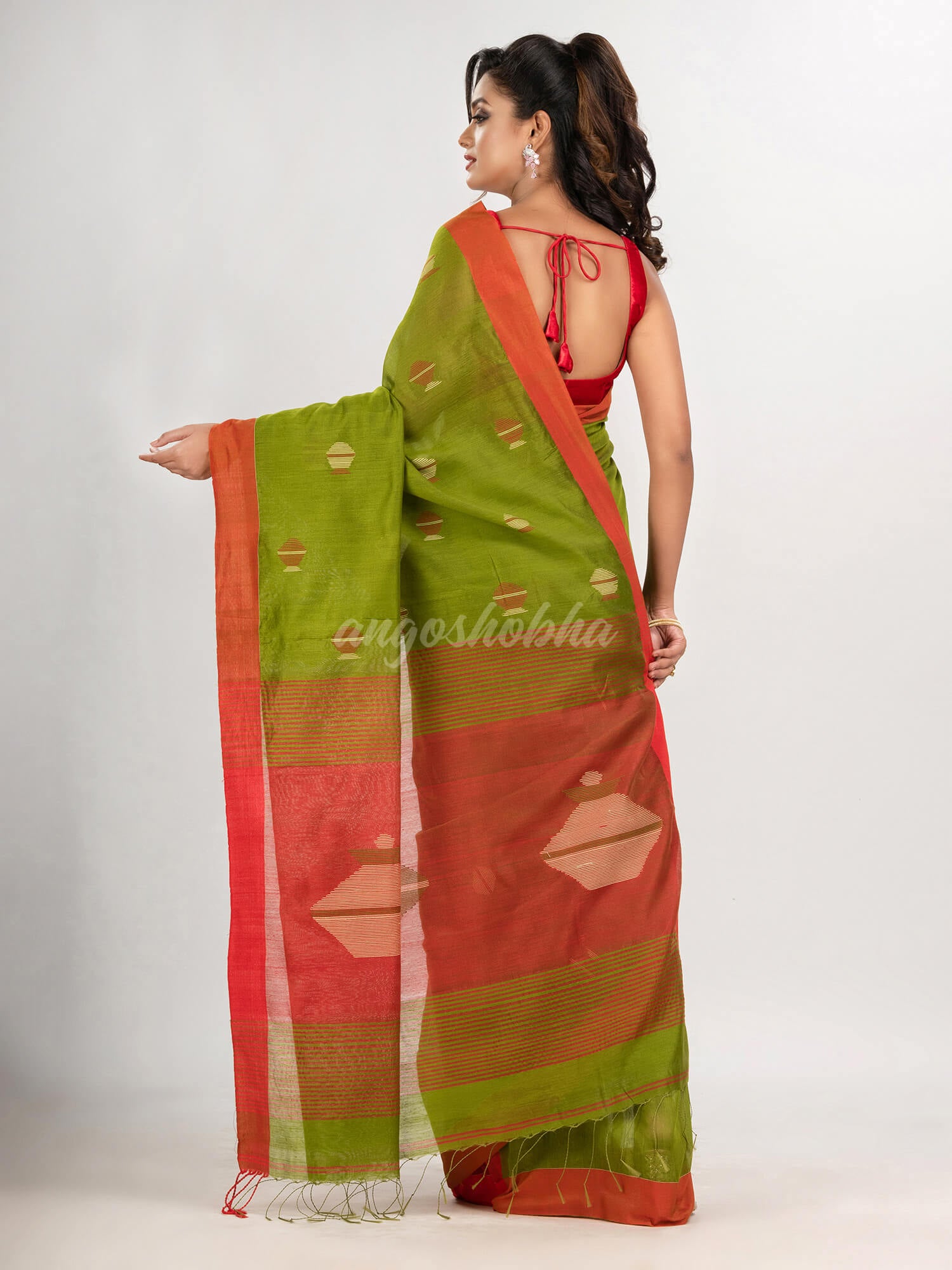 Venom green cotton blend all body noddle motive with red pallu jamdani saree