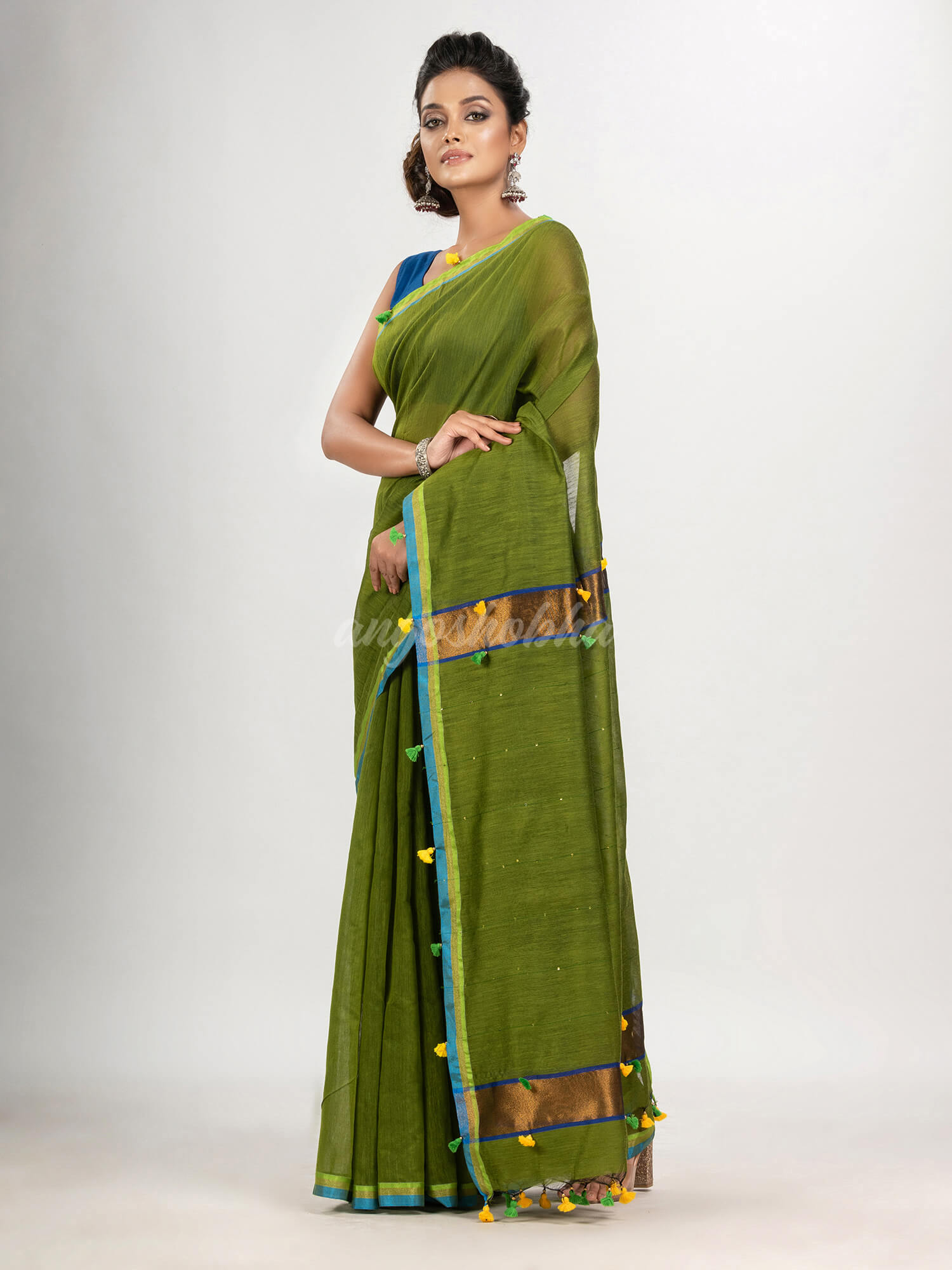 Olive green cotton blend with pompom handloom saree