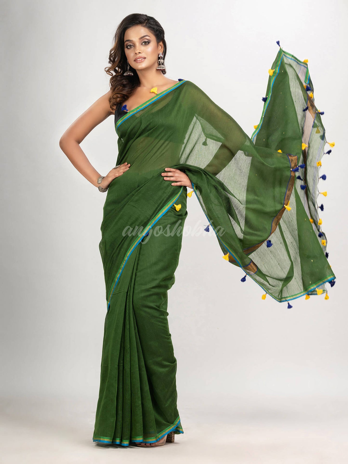 Hunter green cotton blend with pompom handloom saree