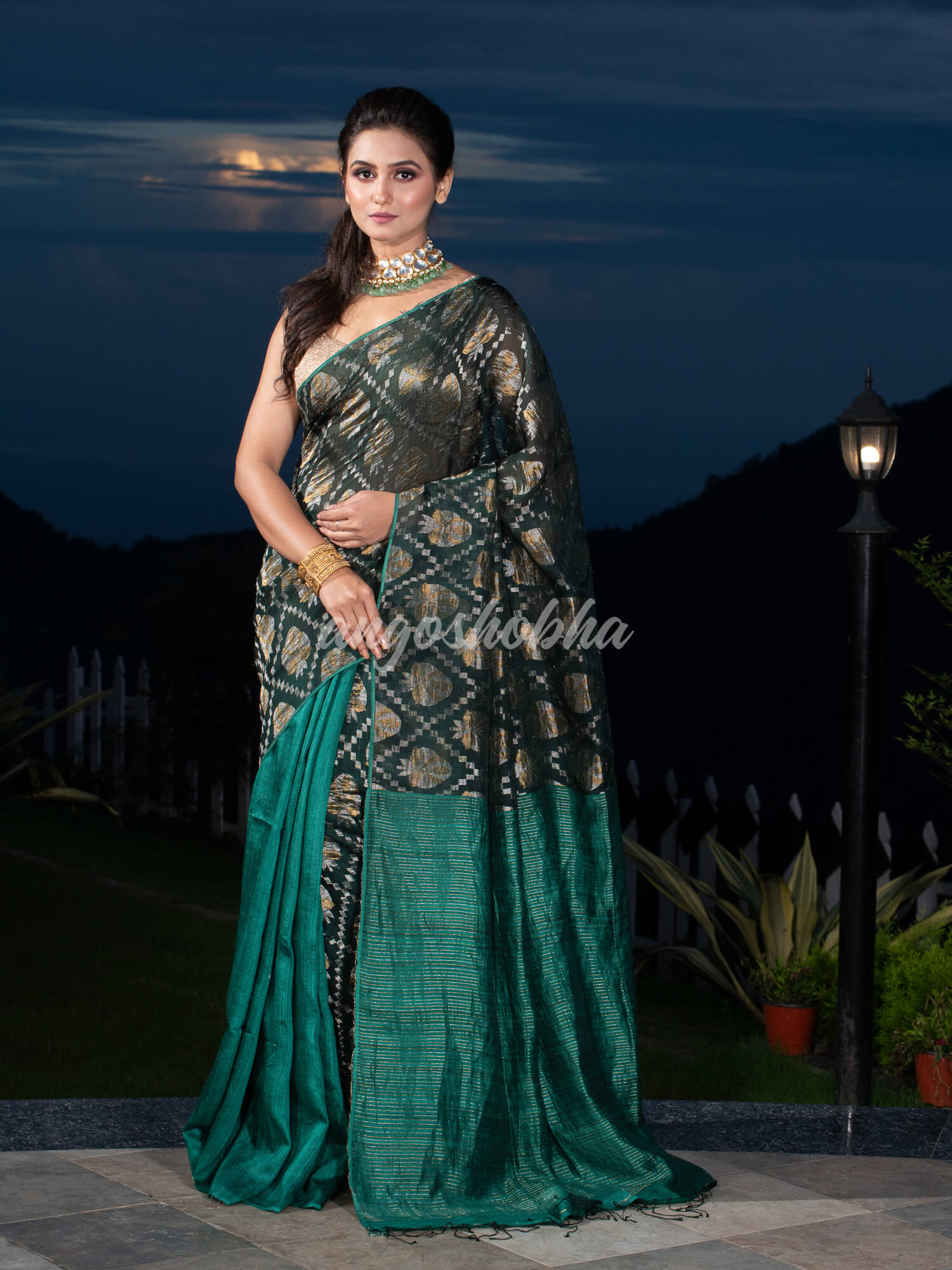 Dark Green Silk Matka Body with Leaves Intricate Design including Silver & Golden Stripes on Check Pallu Handwoven Saree