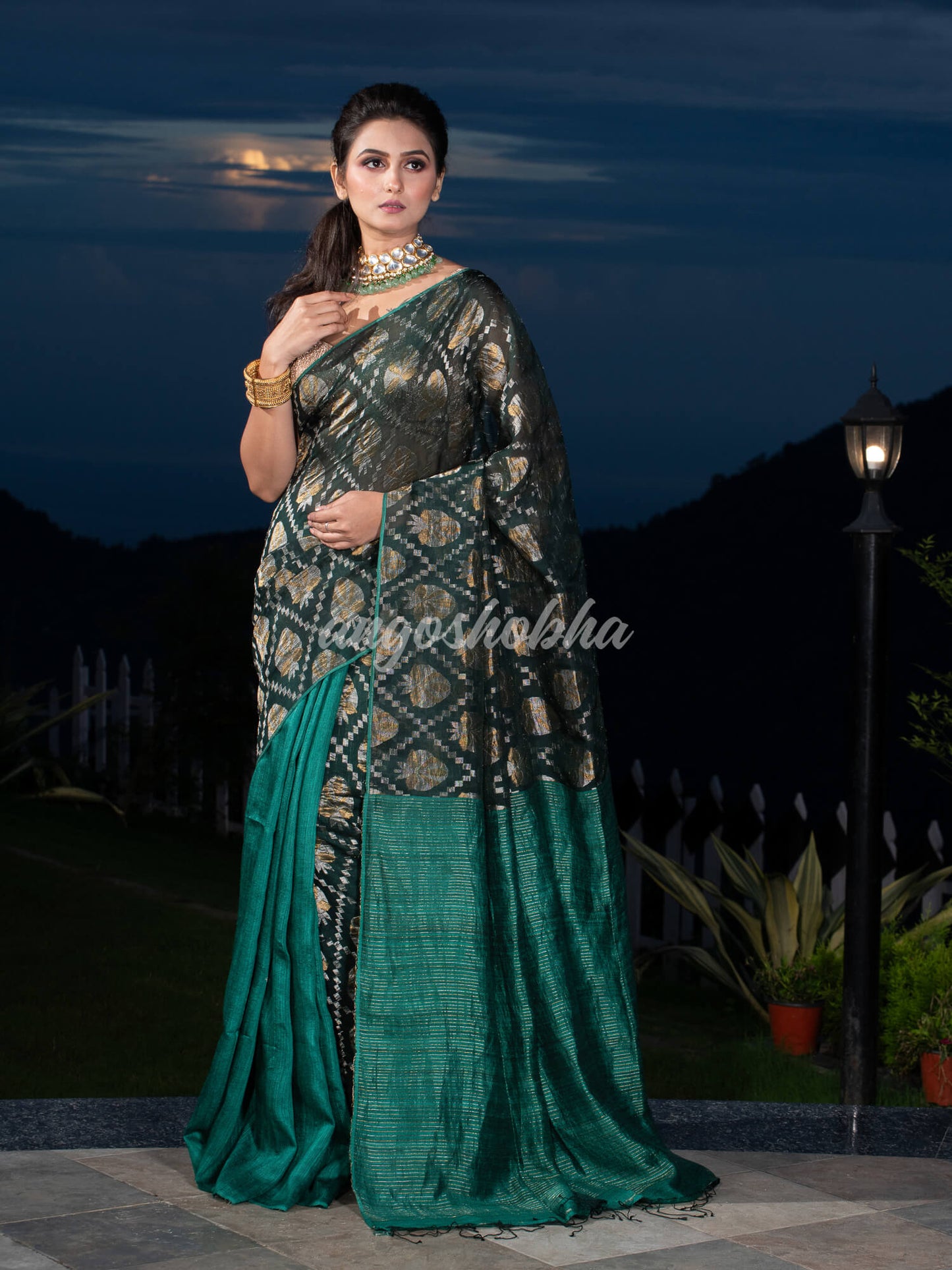 Dark Green Silk Matka Body with Leaves Intricate Design including Silver & Golden Stripes on Check Pallu Handwoven Saree