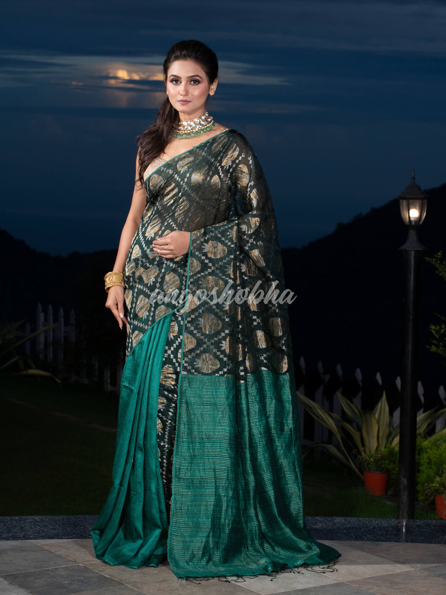 Dark Green Silk Matka Body with Leaves Intricate Design including Silver & Golden Stripes on Check Pallu Handwoven Saree