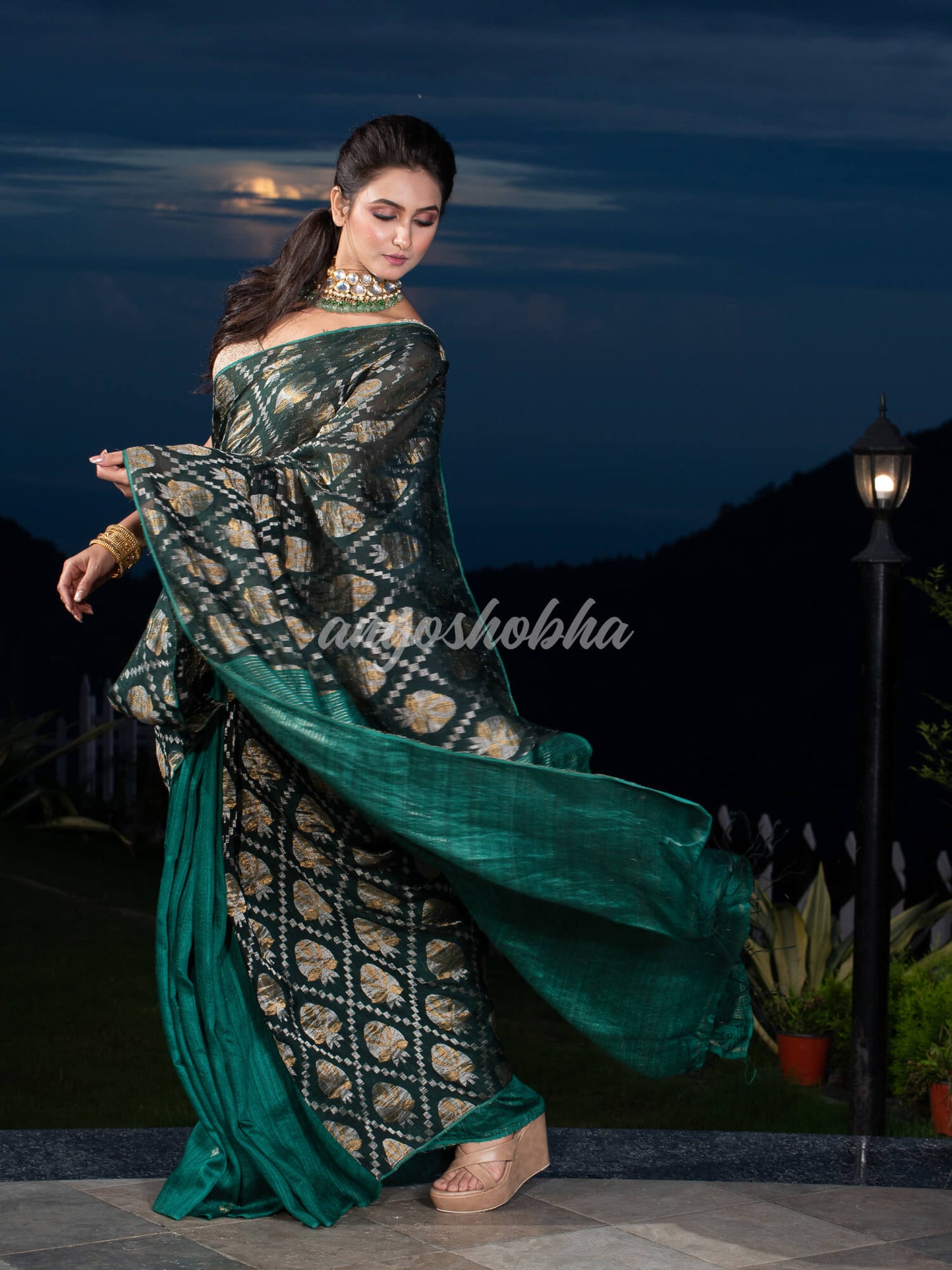 Dark Green Silk Matka Body with Leaves Intricate Design including Silver & Golden Stripes on Check Pallu Handwoven Saree