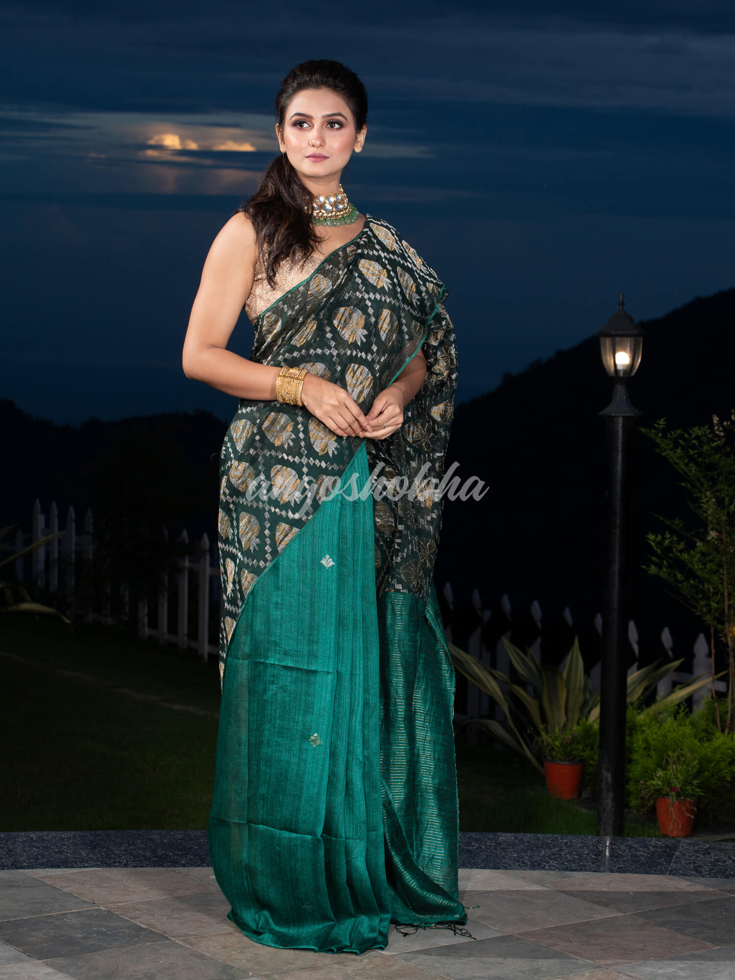 Dark Green Silk Matka Body with Leaves Intricate Design including Silver & Golden Stripes on Check Pallu Handwoven Saree