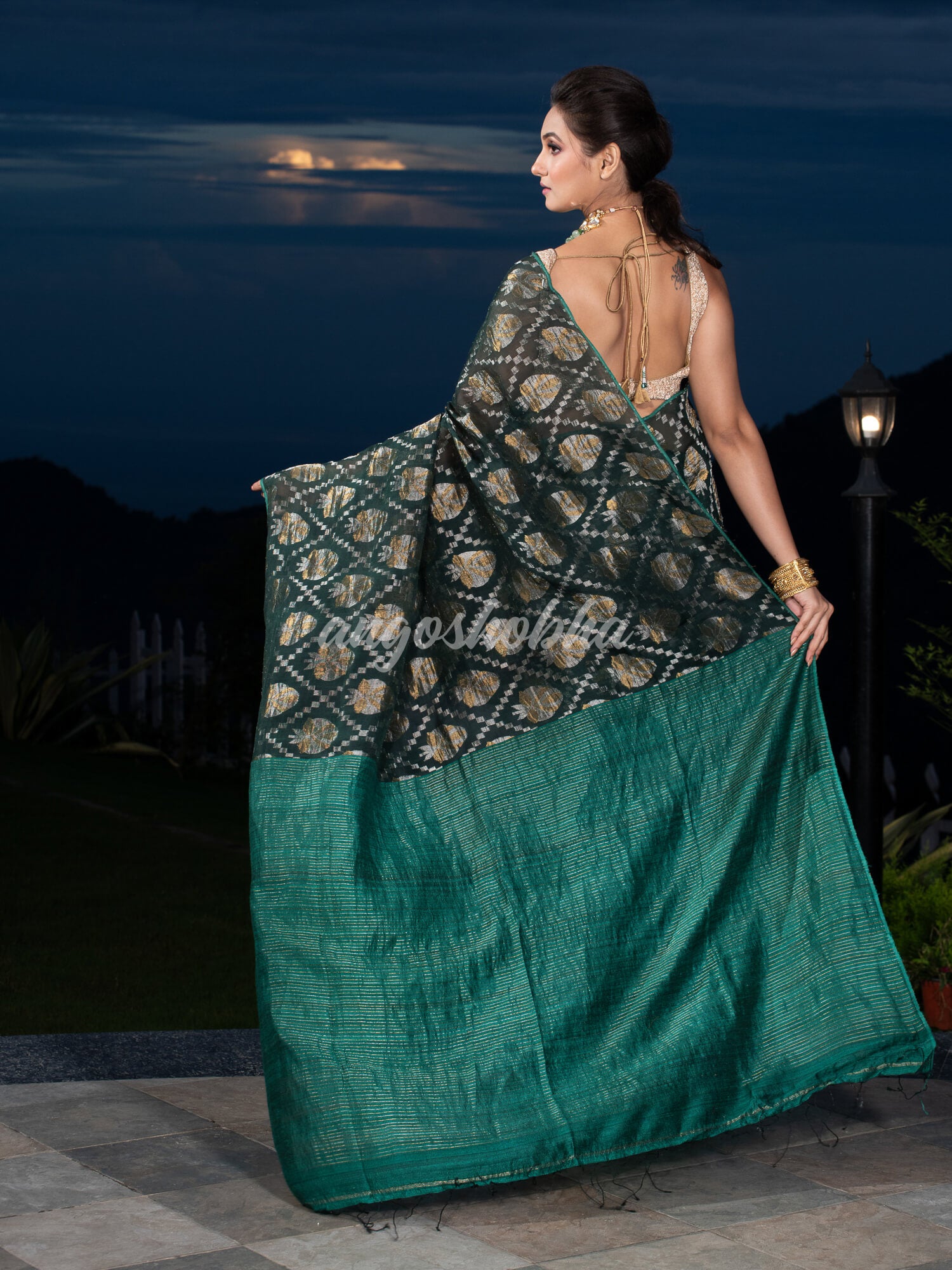 Dark Green Silk Matka Body with Leaves Intricate Design including Silver & Golden Stripes on Check Pallu Handwoven Saree