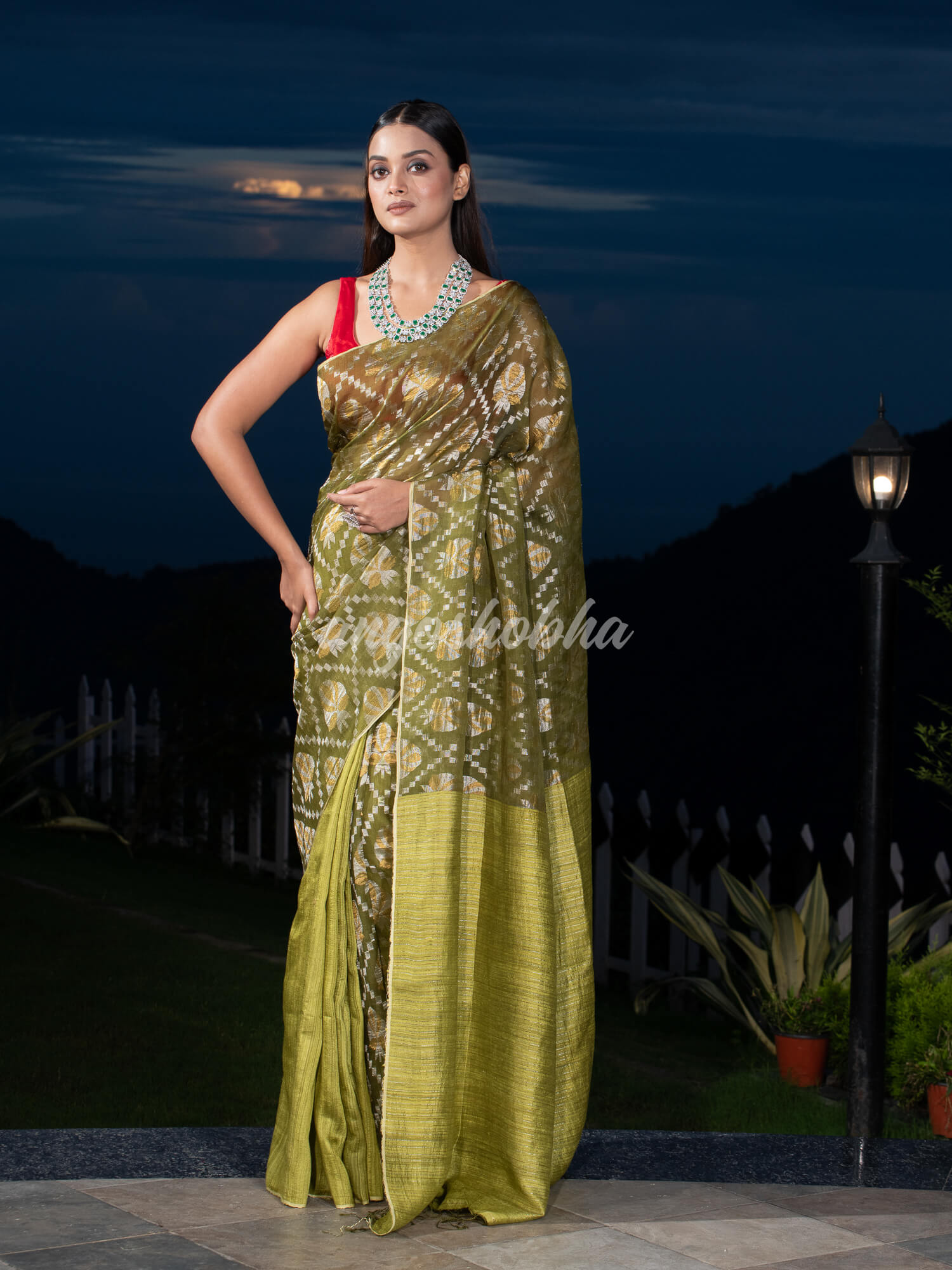 Olive Green Silk Matka Body with Leaves Intricate Design including Silver & Golden Stripes on Check Pallu Handwoven Saree