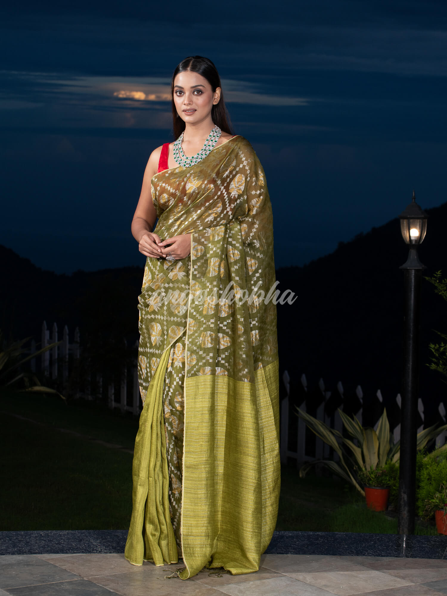 Olive Green Silk Matka Body with Leaves Intricate Design including Silver & Golden Stripes on Check Pallu Handwoven Saree
