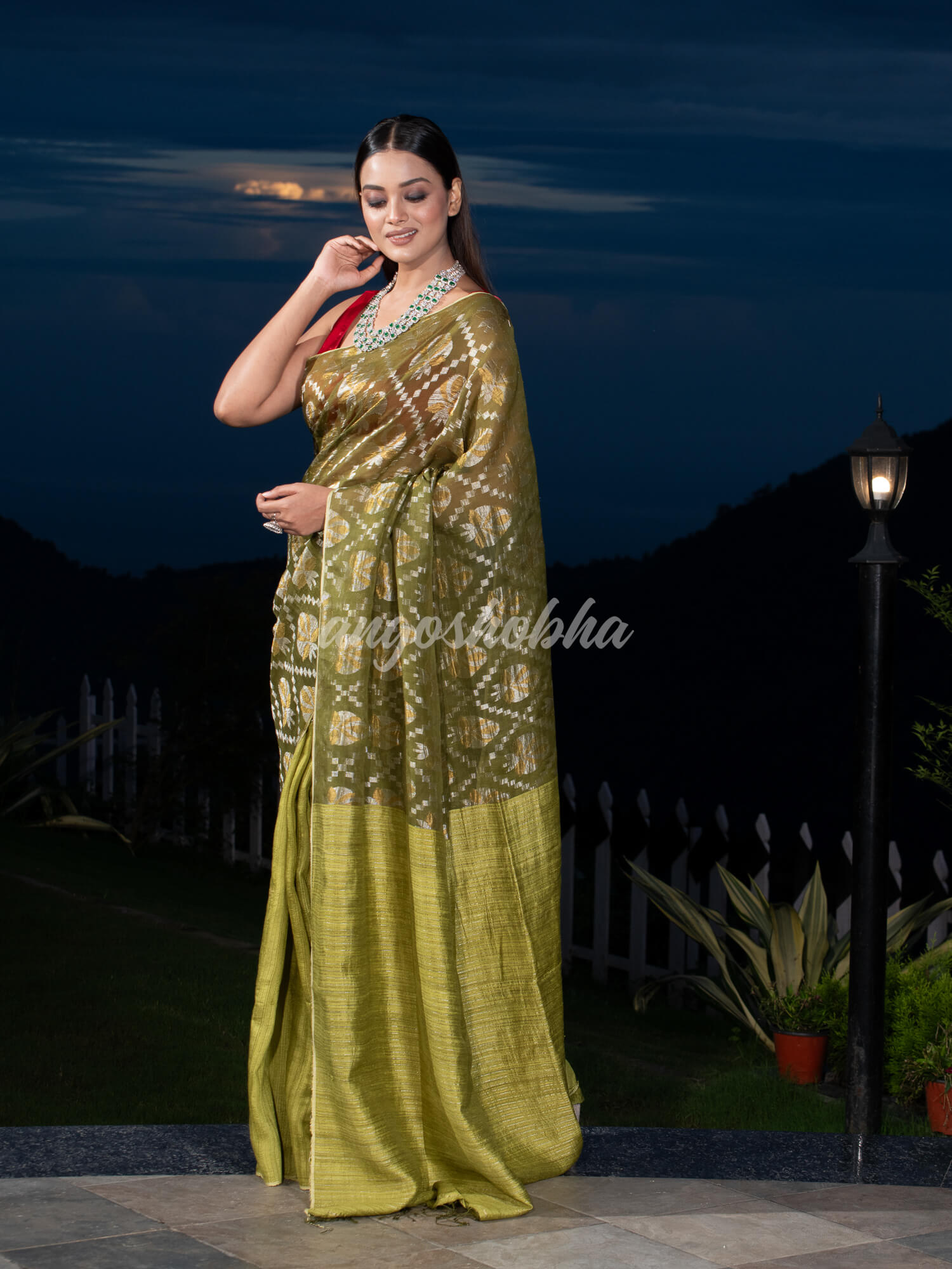 Olive Green Silk Matka Body with Leaves Intricate Design including Silver & Golden Stripes on Check Pallu Handwoven Saree