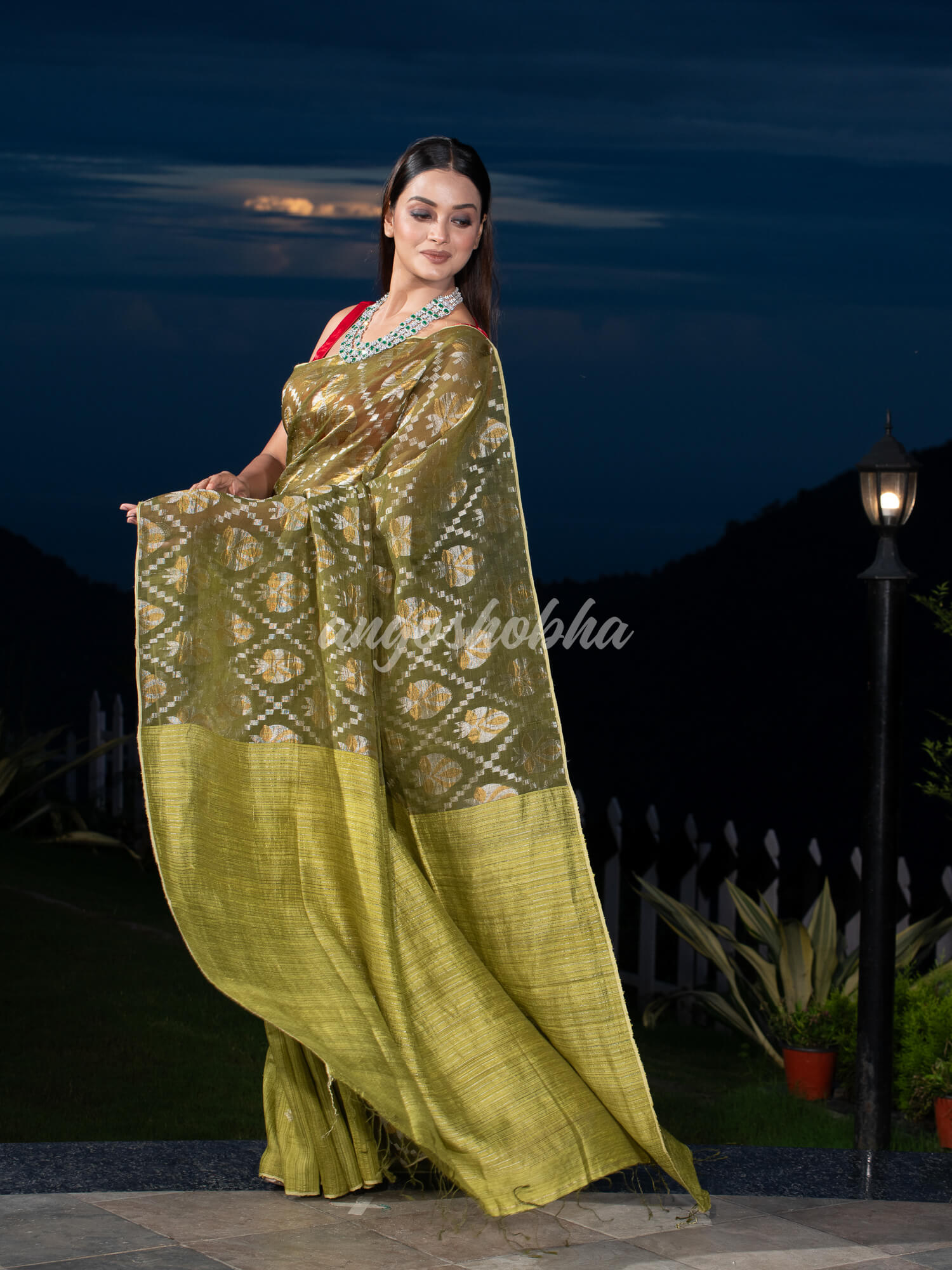 Olive Green Silk Matka Body with Leaves Intricate Design including Silver & Golden Stripes on Check Pallu Handwoven Saree